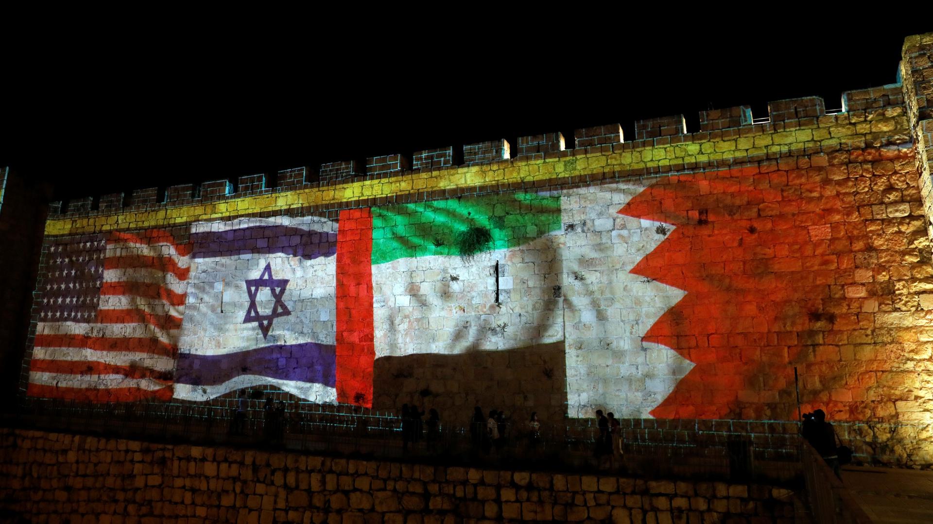 National flags of Bahrain, UAE, Israel and the US are projected onto the walls of Jerusalem's Old city, Sept. 15, 2020.