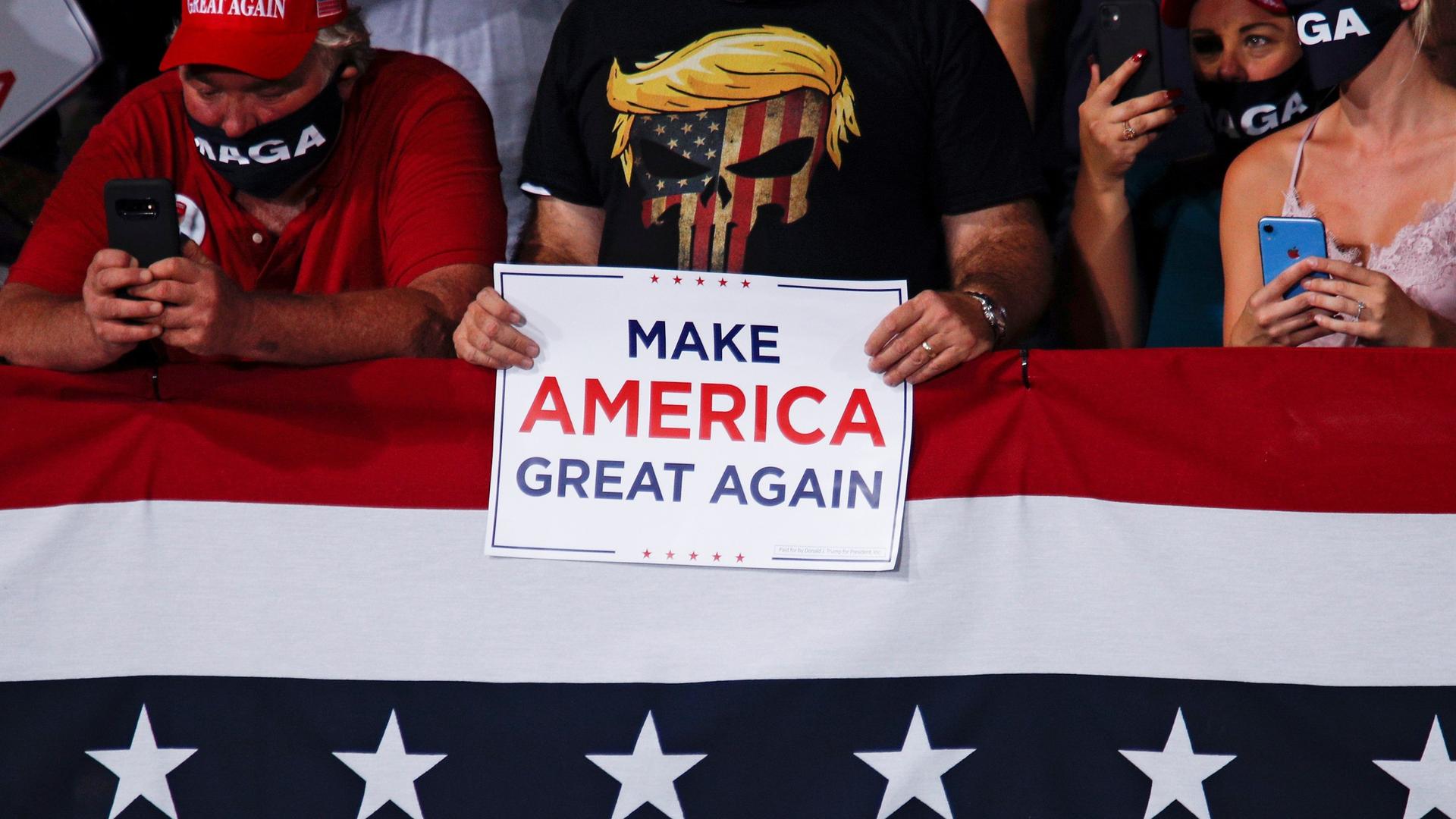 People attend a campaign rally by US President Donald Trump at Cecil Airport in Jacksonville, Florida, Sept. 24, 2020.
