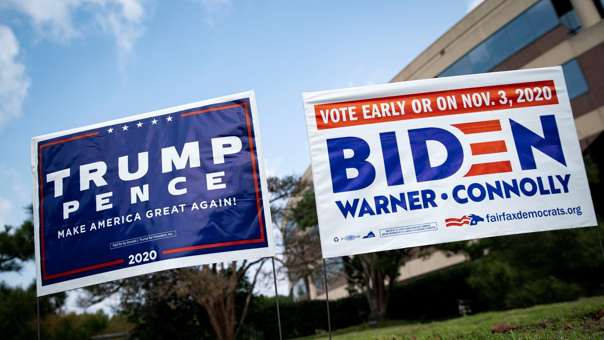 Yard signs supporting US President Donald Trump and Democratic US presidential nominee and former Vice President Joe Biden are seen outside of an early voting site at the Fairfax County Government Center in Fairfax, Virginia, Sept. 18, 2020.