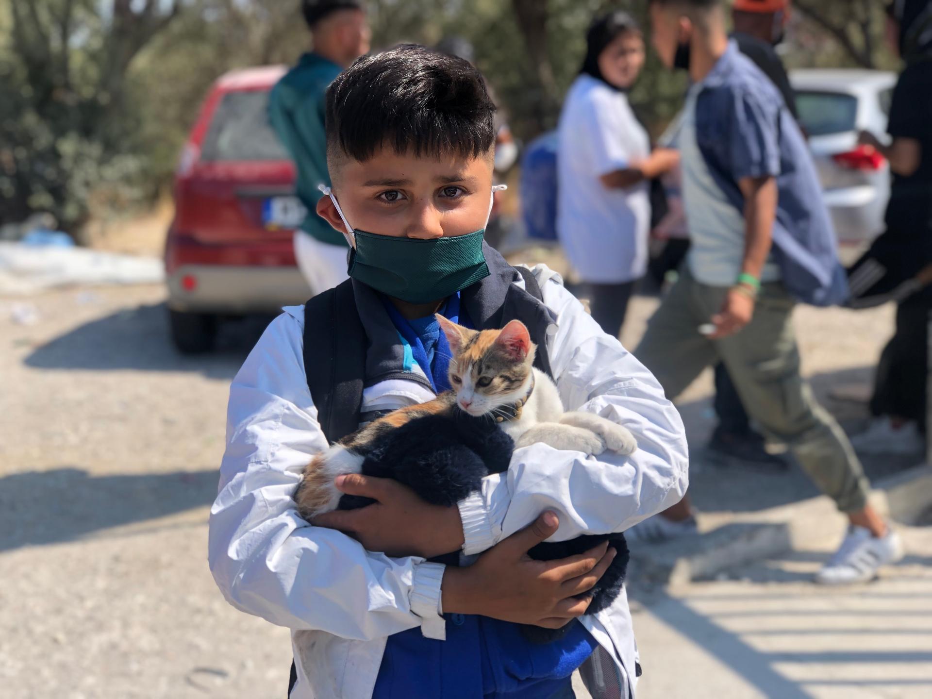 Mohammad, a young, Afghan asylum-seeker, found a cat he named Kuchulu while at Moria. He worries he won't be able to bring his feline friend into the new camp.