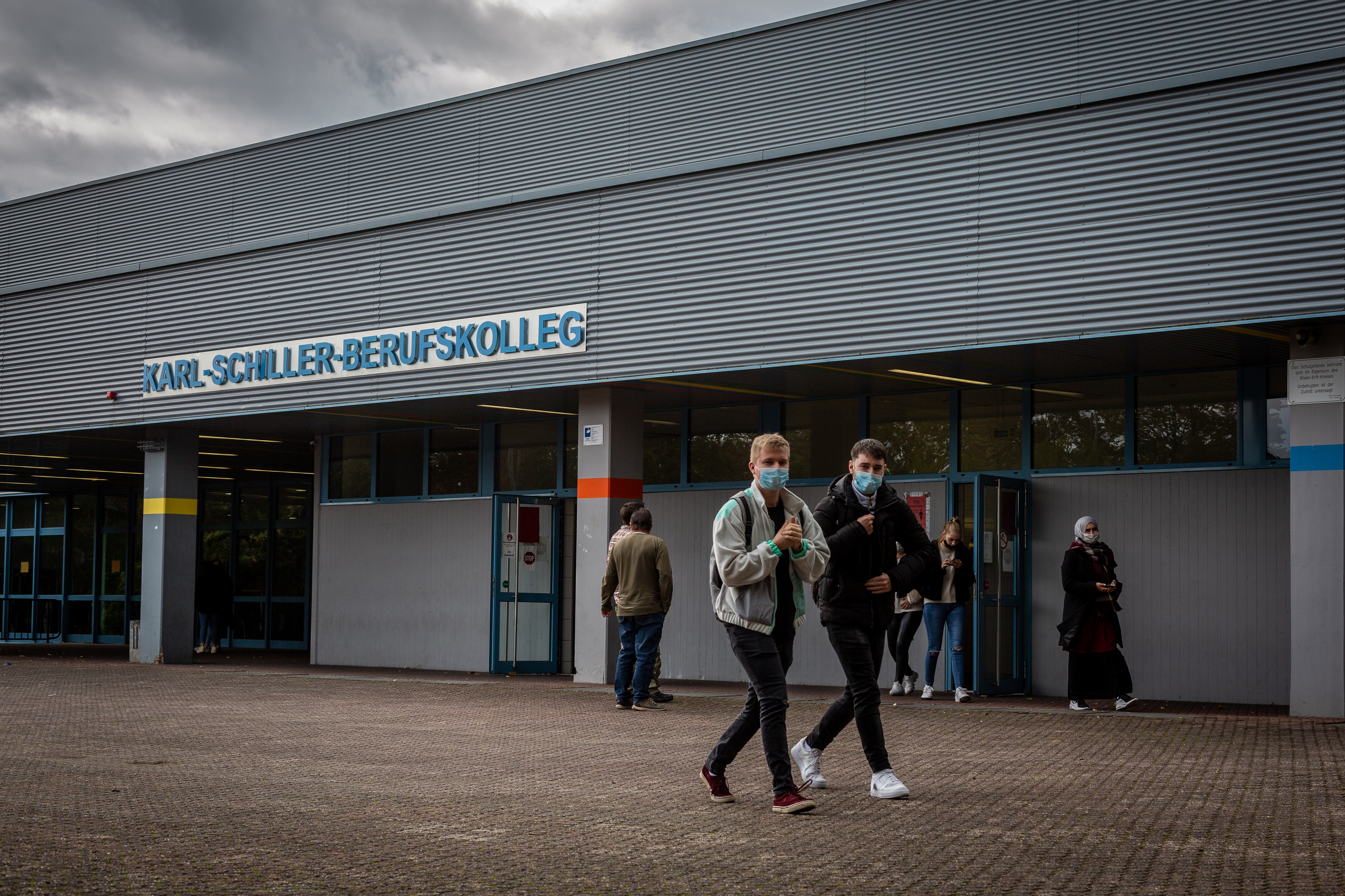 Students leave Karl-Schiller-Berufskolleg in Brühl, a  secondary school outside of Cologne, Germany. Students are required by the school to wear masks on schools grounds.