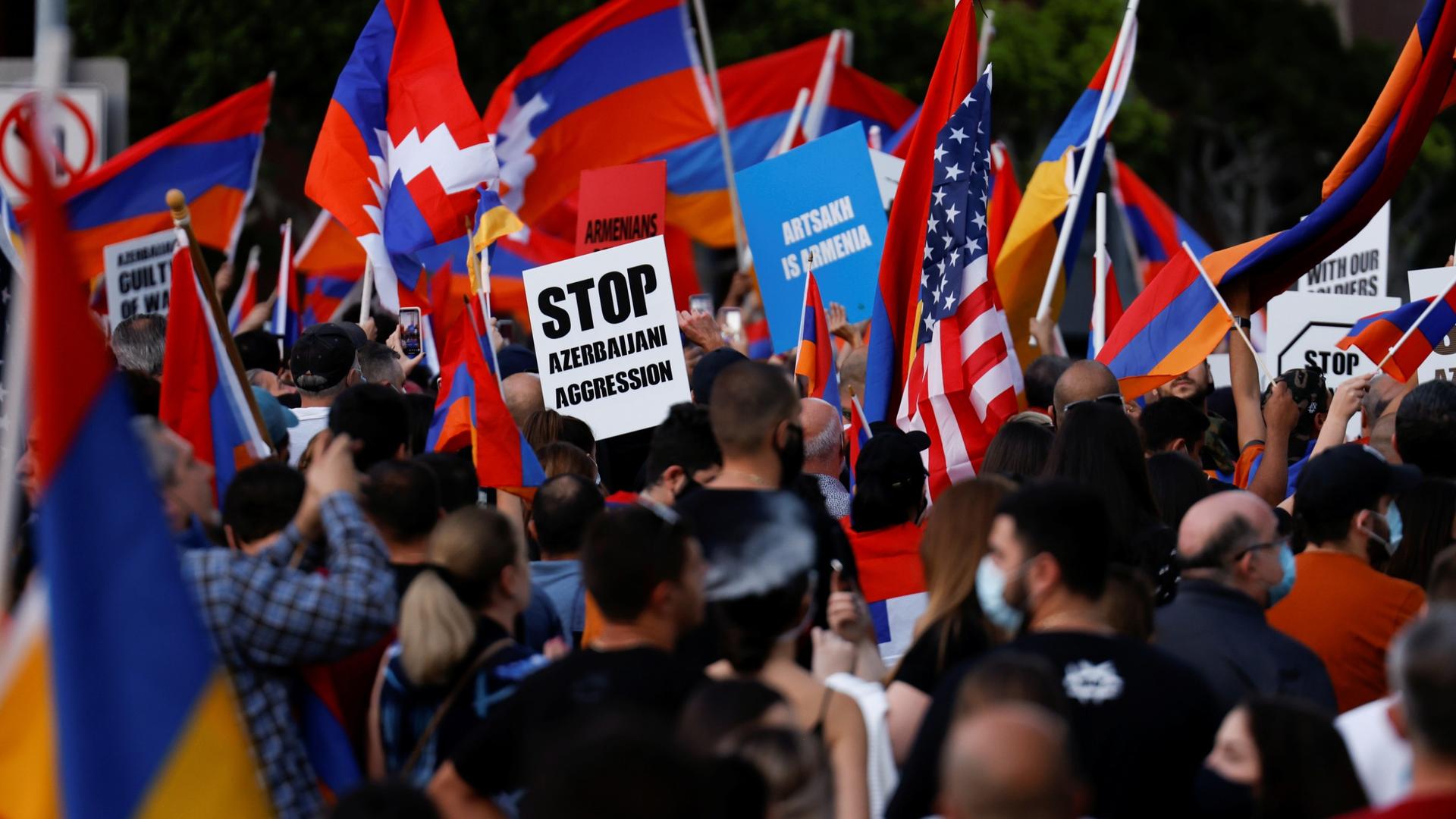 People take part in a protest by Armenian Youth Federation against what they refer to as Azerbaijan's aggression against Armenia and the breakaway Nagorno-Karabakh region, outside the Azerbaijani Consulate General in Los Angeles, Calif., Sept. 30, 2020.