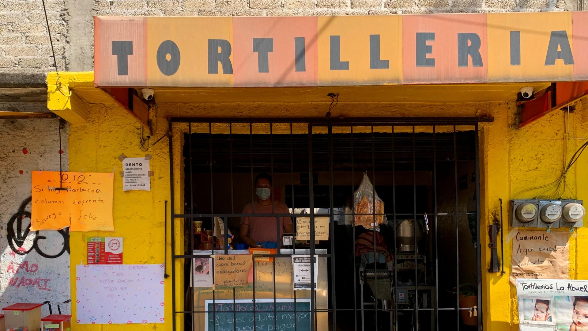 Fernando Lozano, co-owner of La Abuela tortilla shop in southern Mexico City, stands inside his bakery.