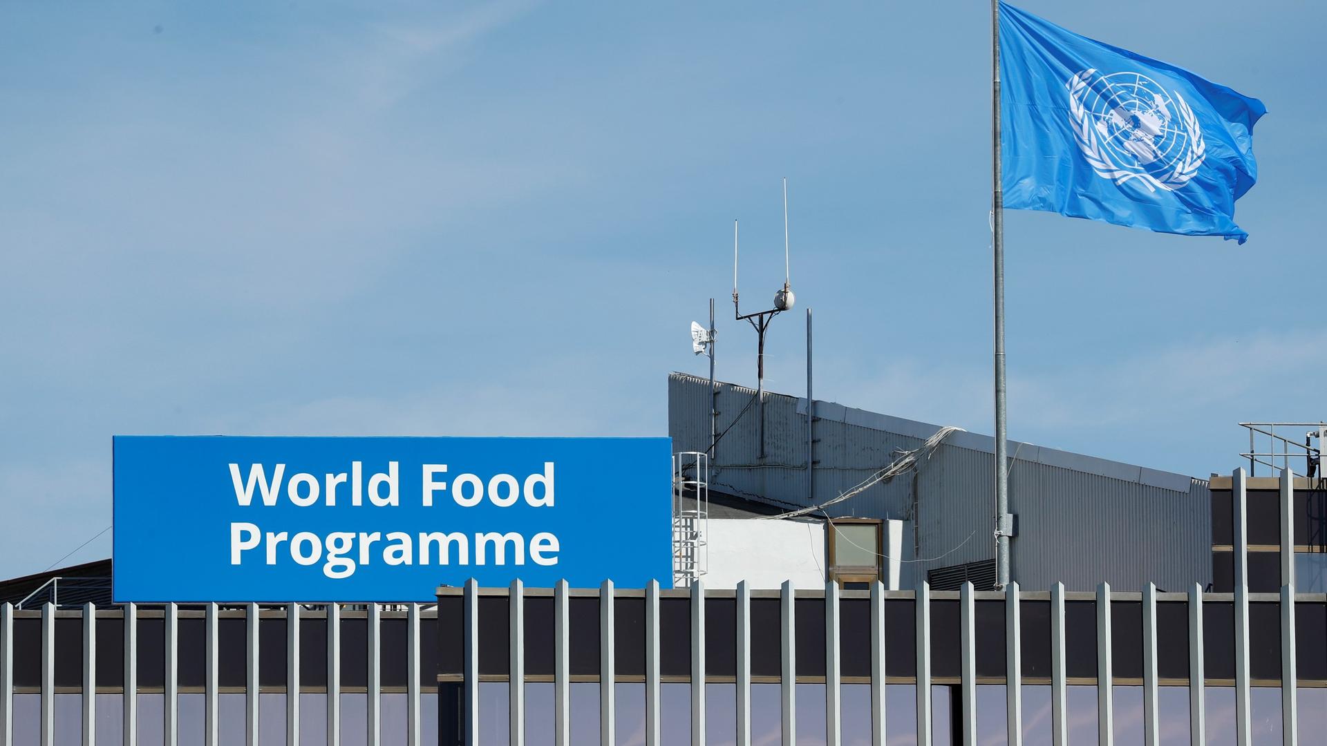 The World Food Program's flag flutters on the roof of WFP headquaters after the organization won the 2020 Nobel Peace Prize, in Rome, Italy, Oct. 9, 2020.