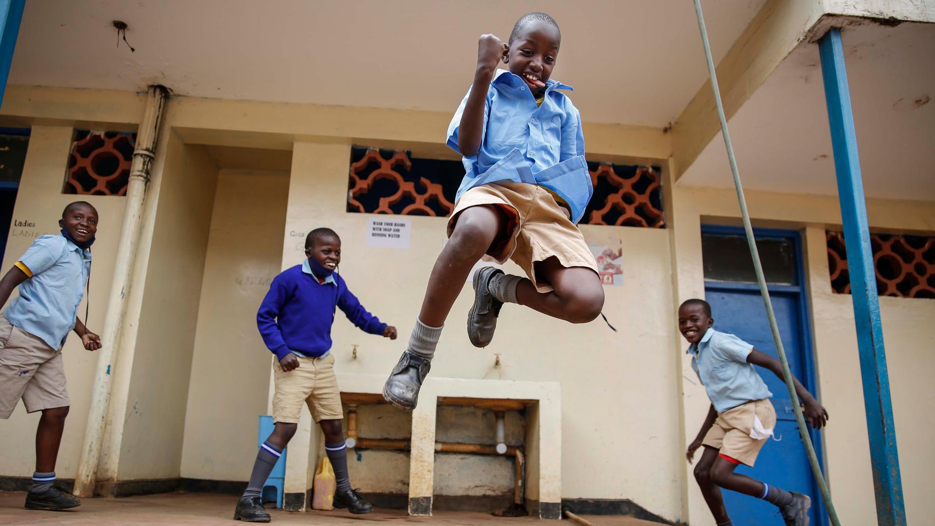 Schoolchildren joke around and play at the Olympic Primary School in Kibera, Kenya, on Oct. 12, 2020.