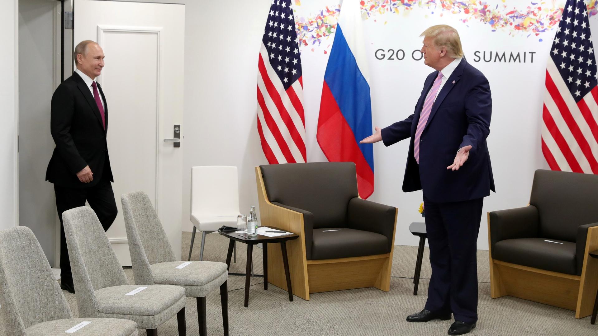 Russia's President Vladimir Putin is greeted by US President Donald Trump at the G20 summit in Osaka, Japan, June 28, 2019.