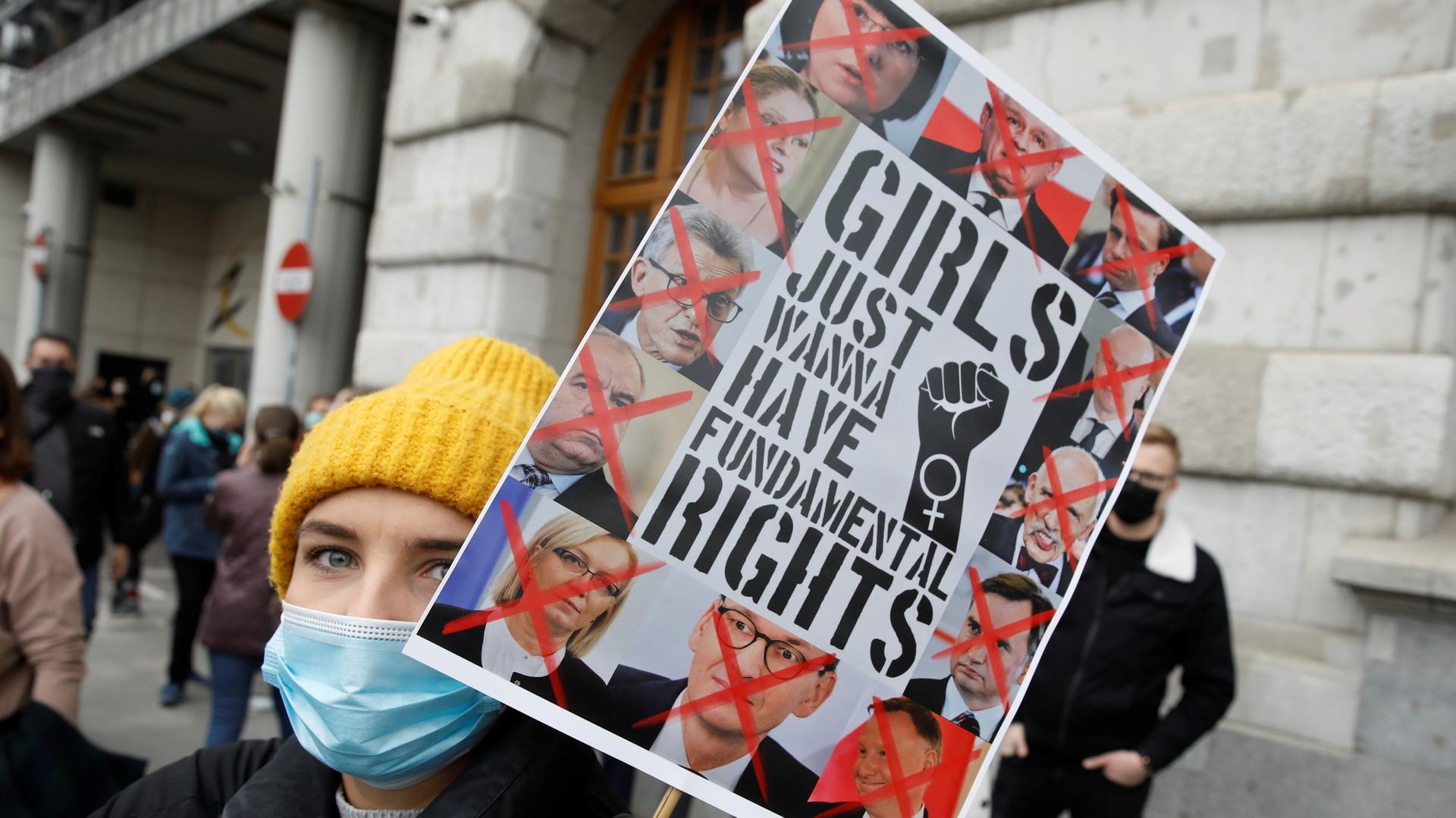 A woman takes part in the protest against the high court ruling, in Warsaw, Poland. 