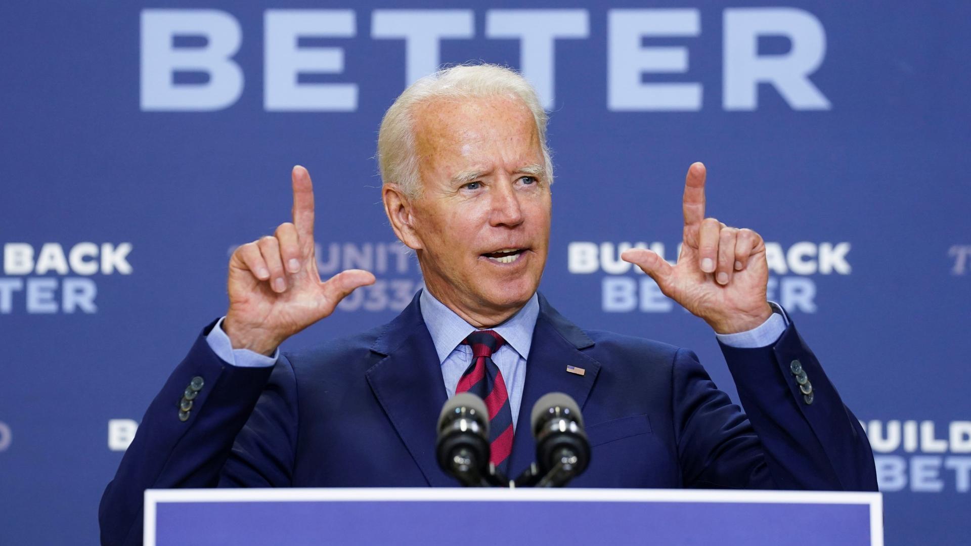 Democratic US presidential nominee and former Vice President Joe Biden answers questions from reporters after a speech about the effects on the economy of the Trump administration's response to the coronavirus during an appearance in Wilmington, Del., Sep