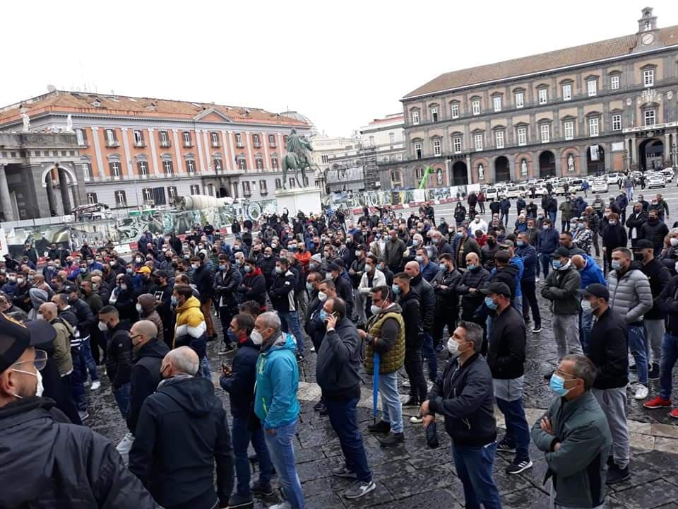 Protesters in Naples gather to speak out against the new coronavirus restrictions.