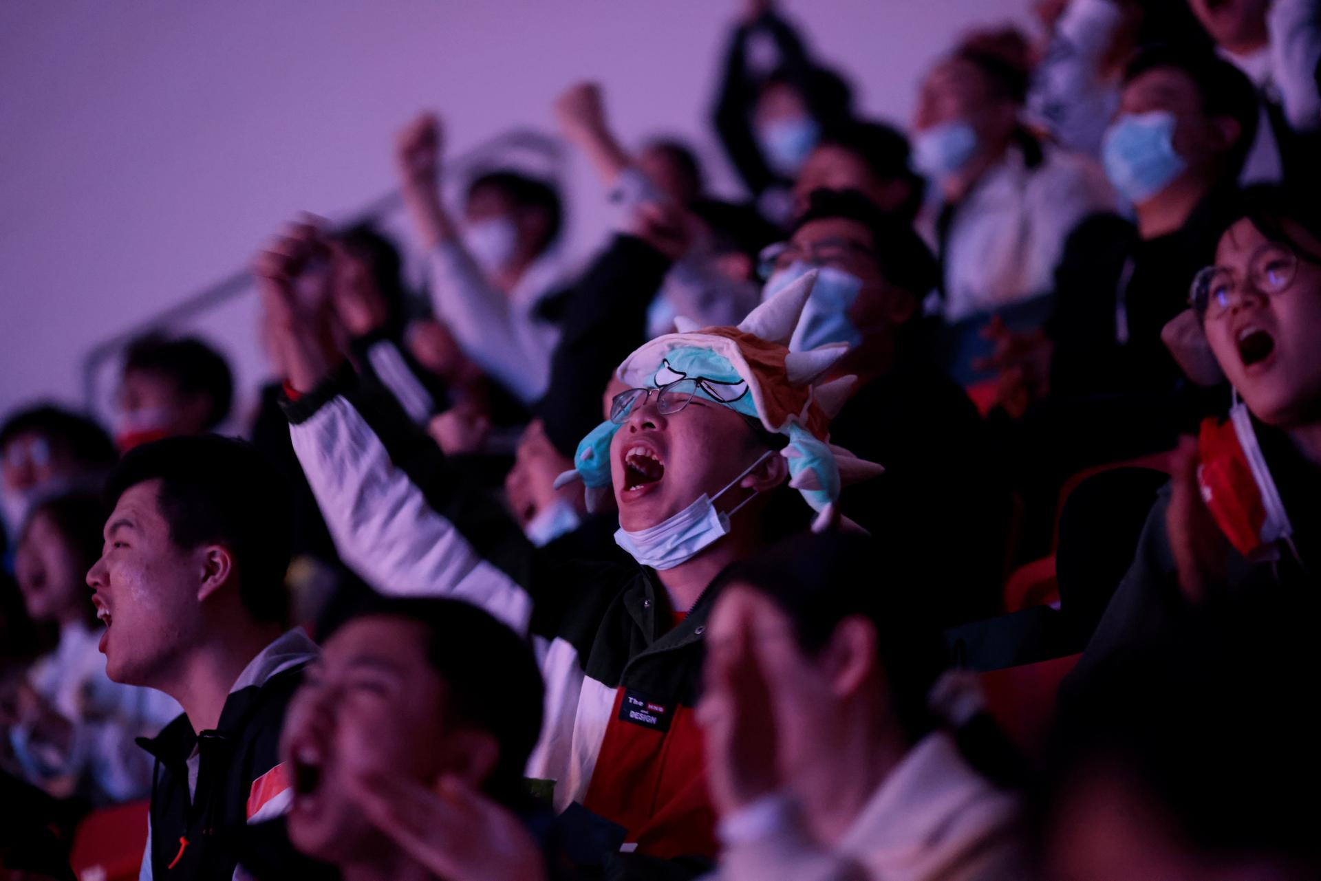 Fans react at the League of Legends (LOL) World Championship Finals, in Shanghai.