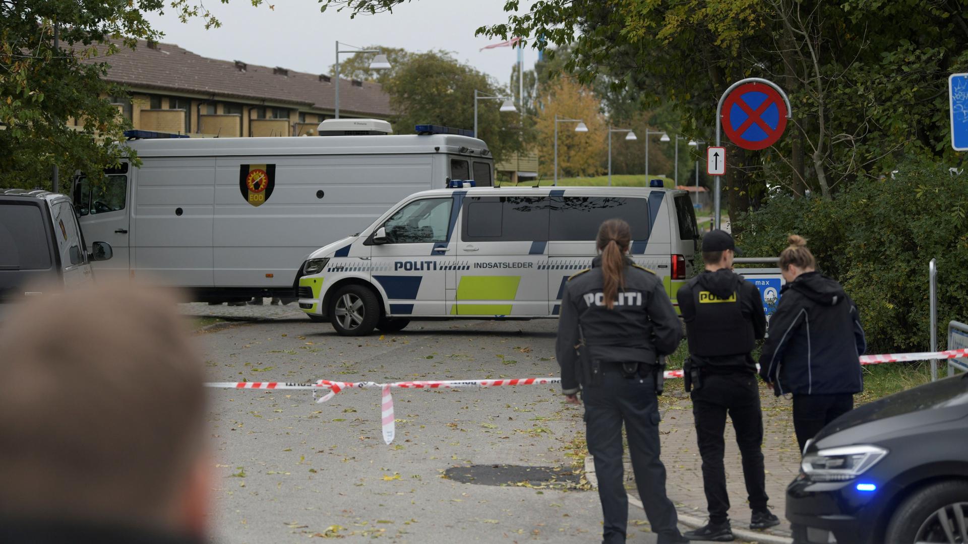 Police officers are seen as Peter Madsen (not pictured) is surrounded by the police in Albertslund, Denmark, Oct. 20, 2020.
