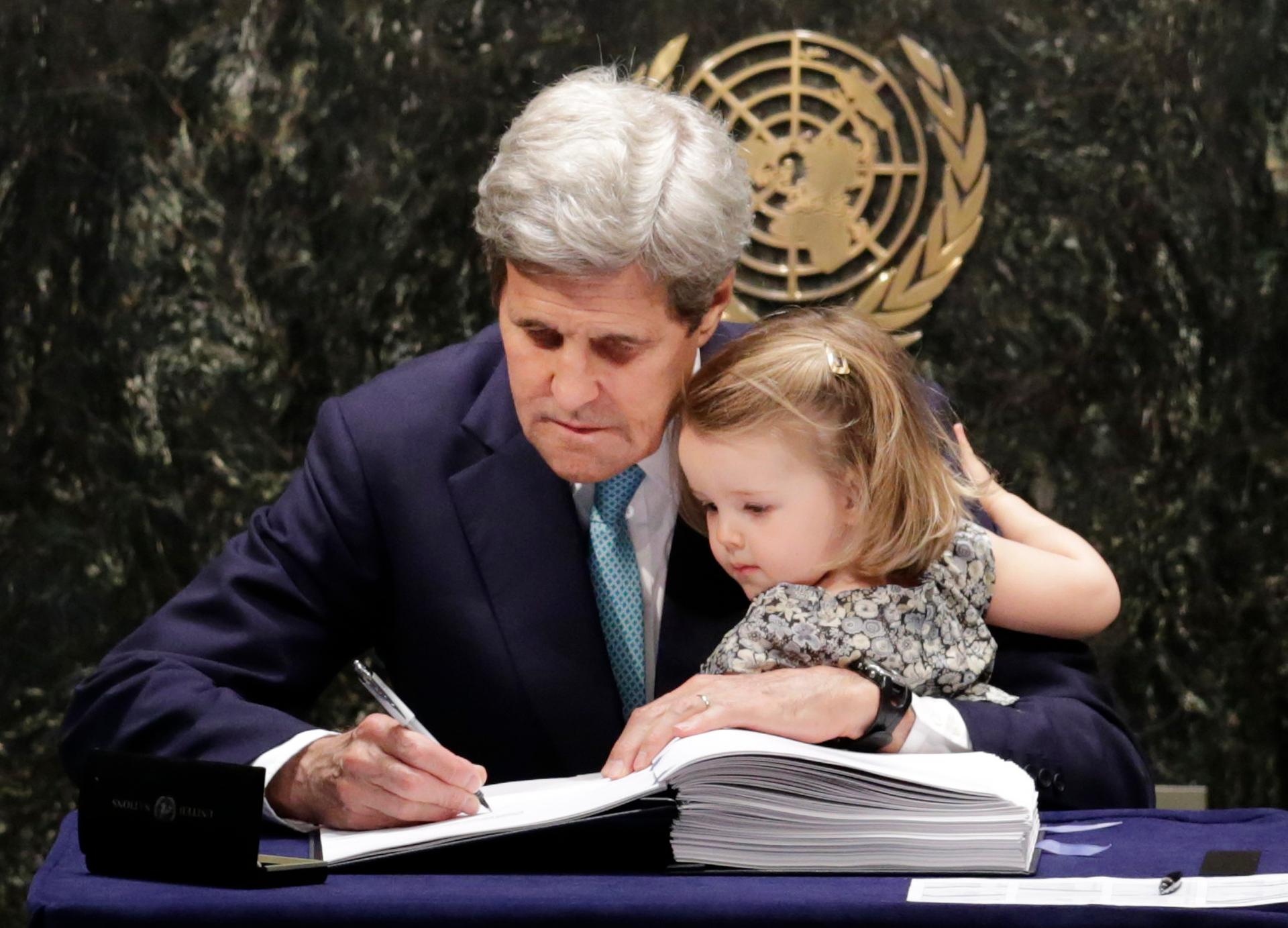 John Kerry and his cute granddaughter at the UN, where he is signing the treaty