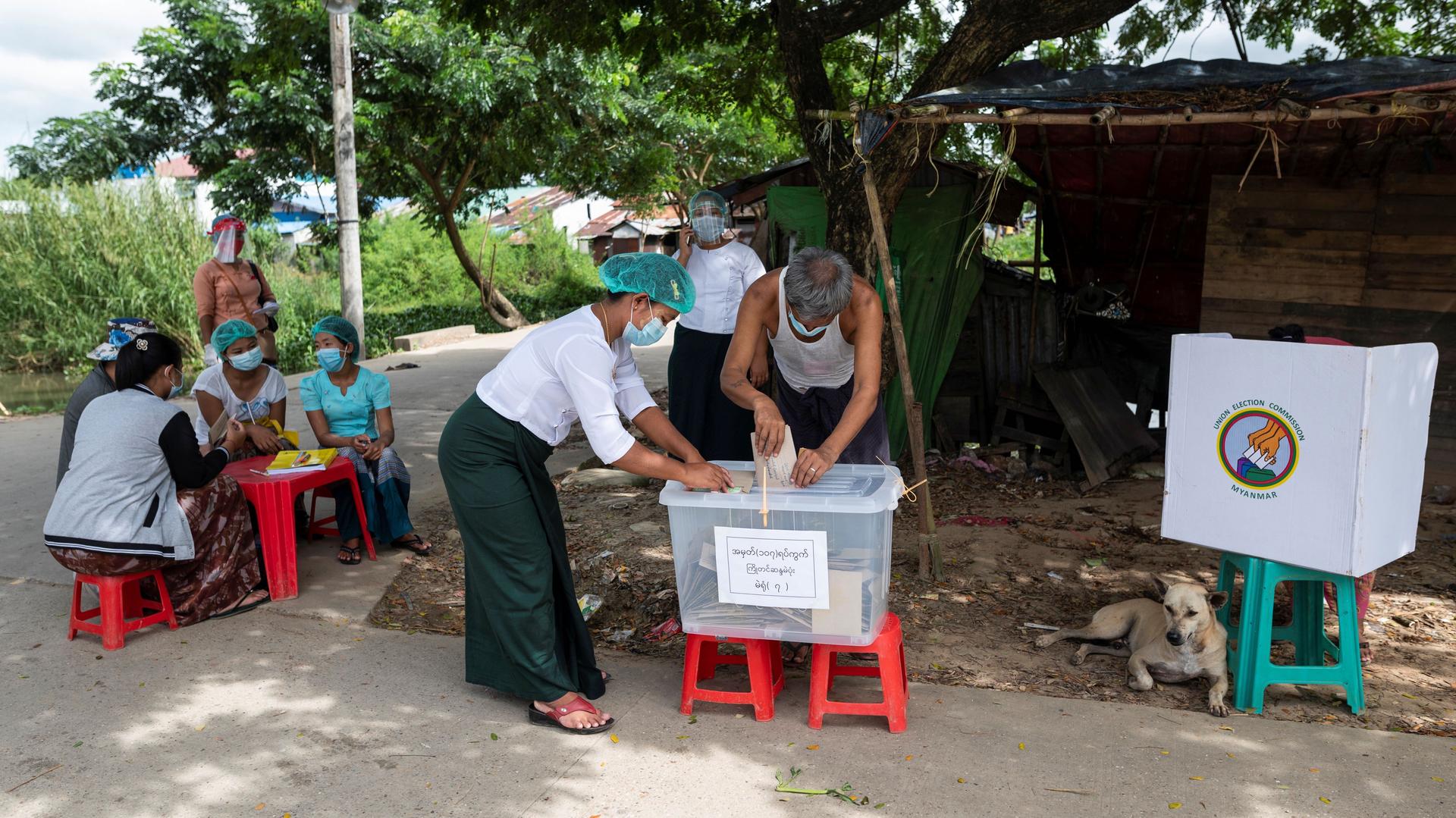 A man cast his ballot during the early voting ahead of the Nov. 8 general election, amid the coronavirus disease (COVID-19) spread in Yangon, Myanmar, Oct. 30, 2020. 