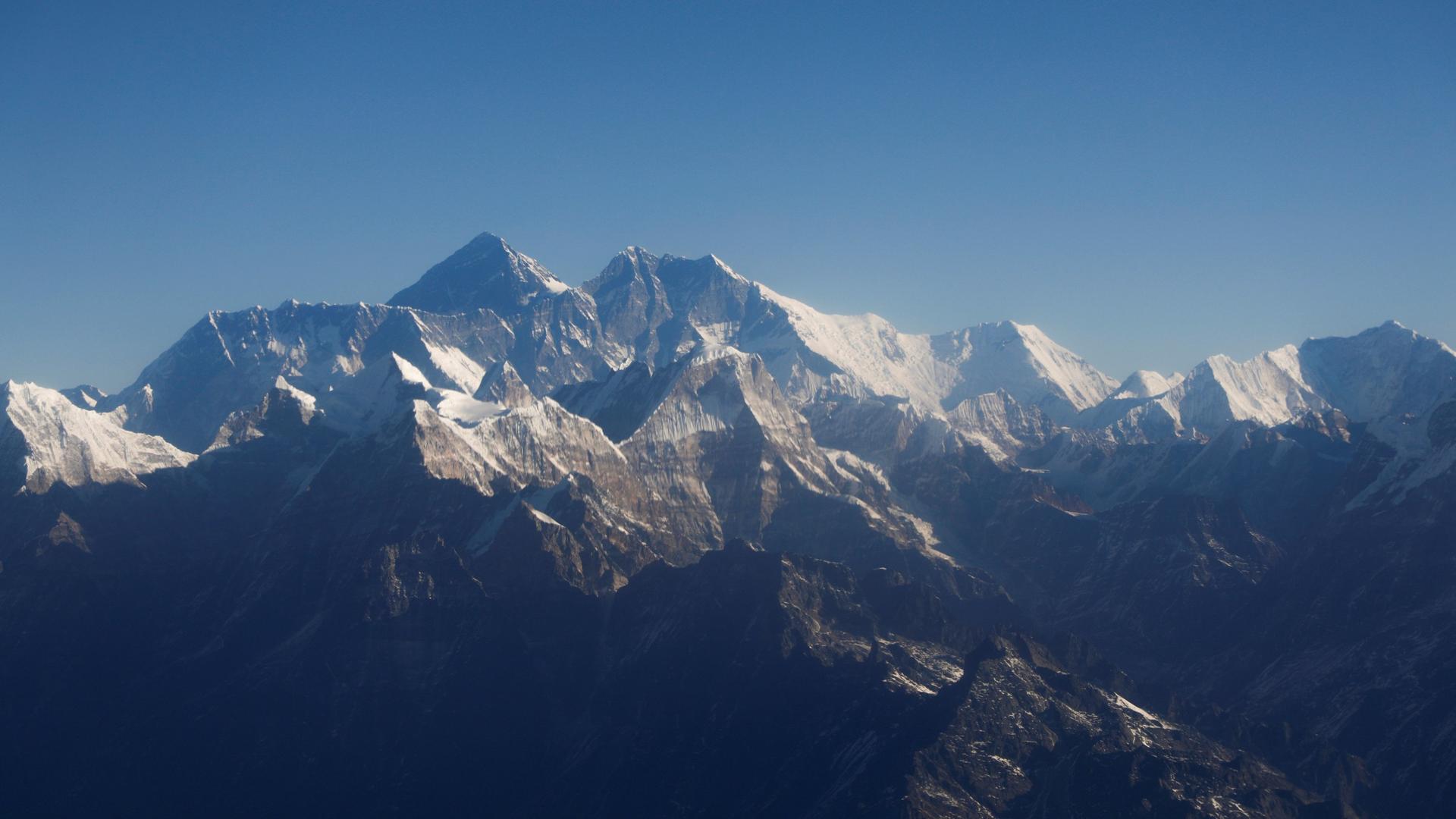 Mount Everest, the world highest peak, and other peaks of the Himalayan range are seen through an aircraft window during a mountain flight from Kathmandu, Nepal, Jan. 15, 2020.