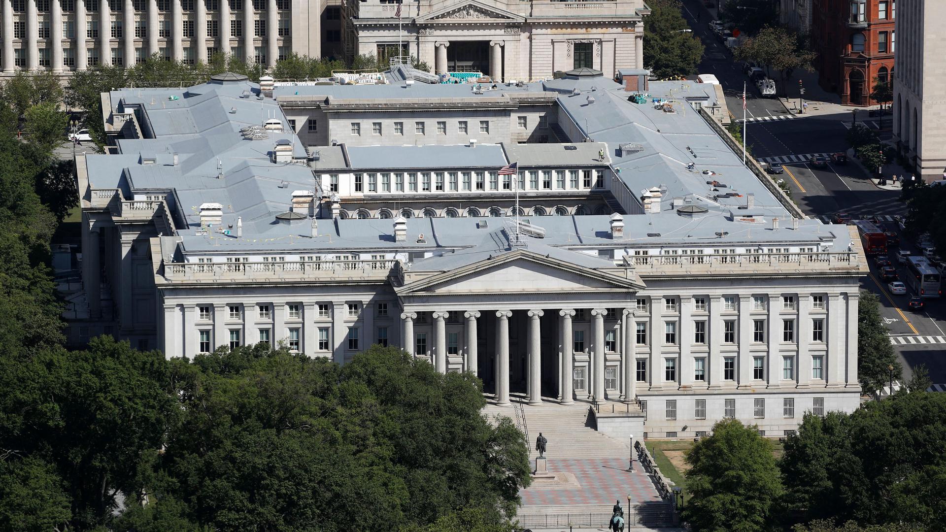 The US Treasury Department building is shown from above with its large Greek columns marking the entrance.