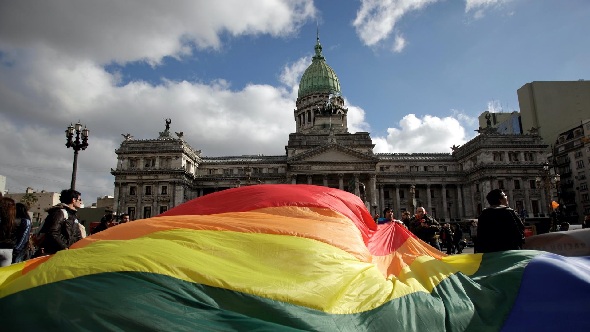 Demonstrators wave a large rainbow flag outside congress in support of a proposal to legalize same-sex marriage in Buenos Aires. 