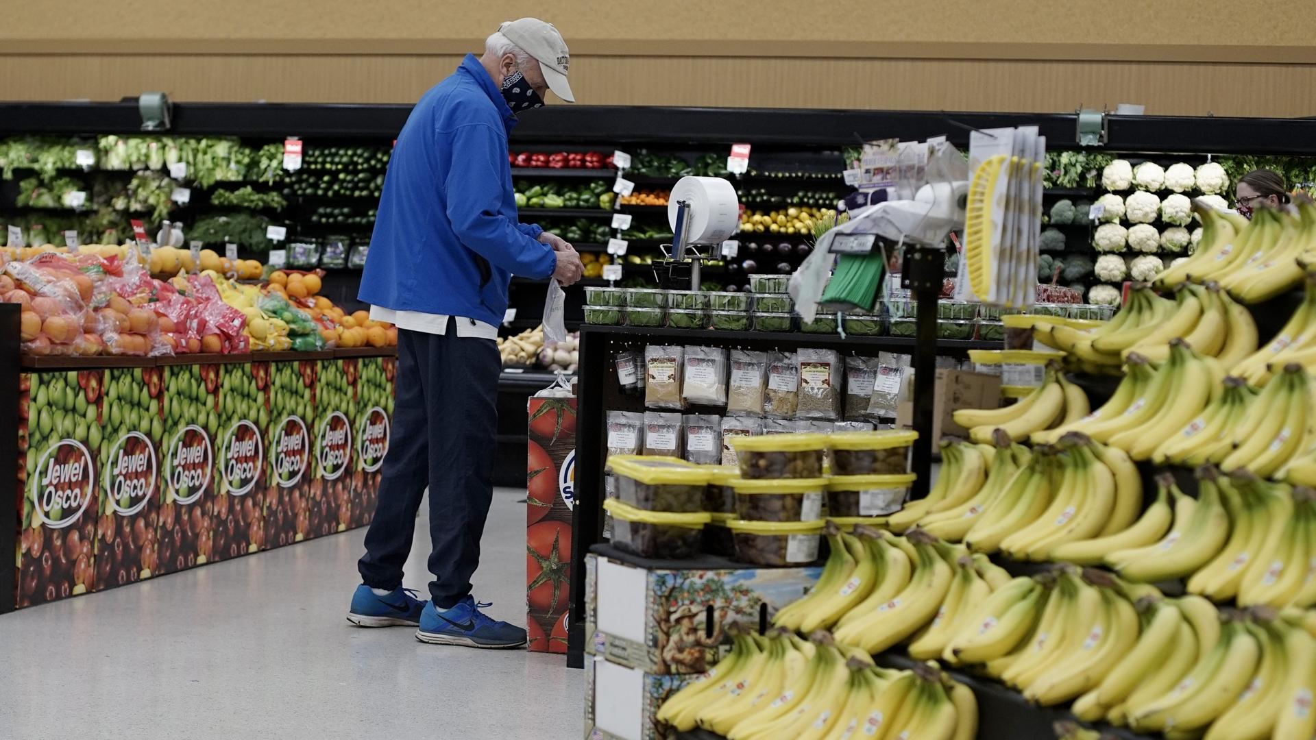 Man shopping in the produce section of an American grocery store
