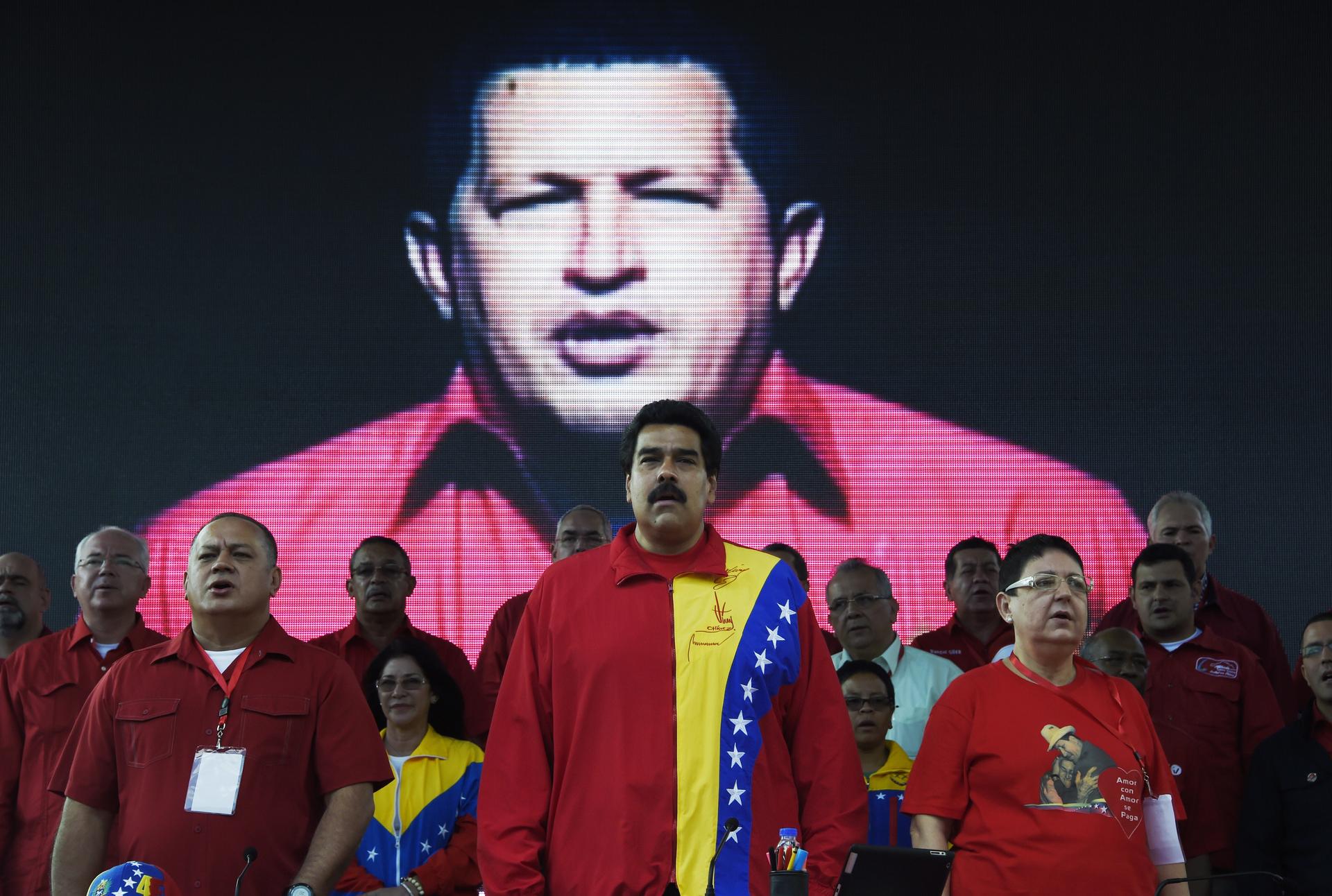 Venezuelan President Nicolas Maduro is seen standing among other guests and authorities.