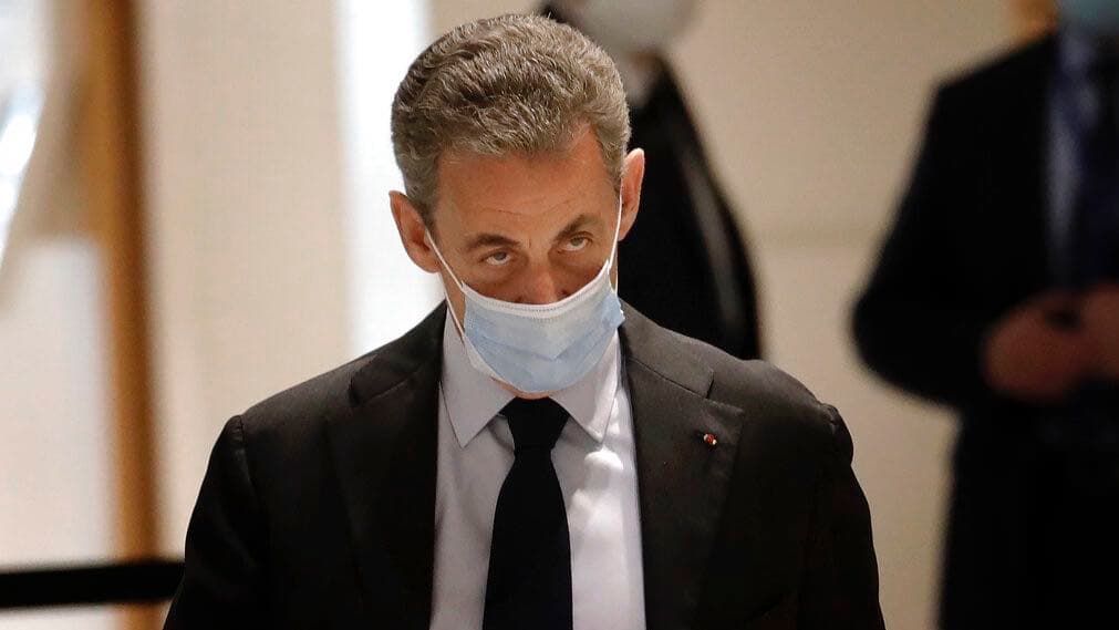 Former French President Nicolas Sarkozy arrives at the courtroom Monday, Nov. 30, 2020, in Paris.