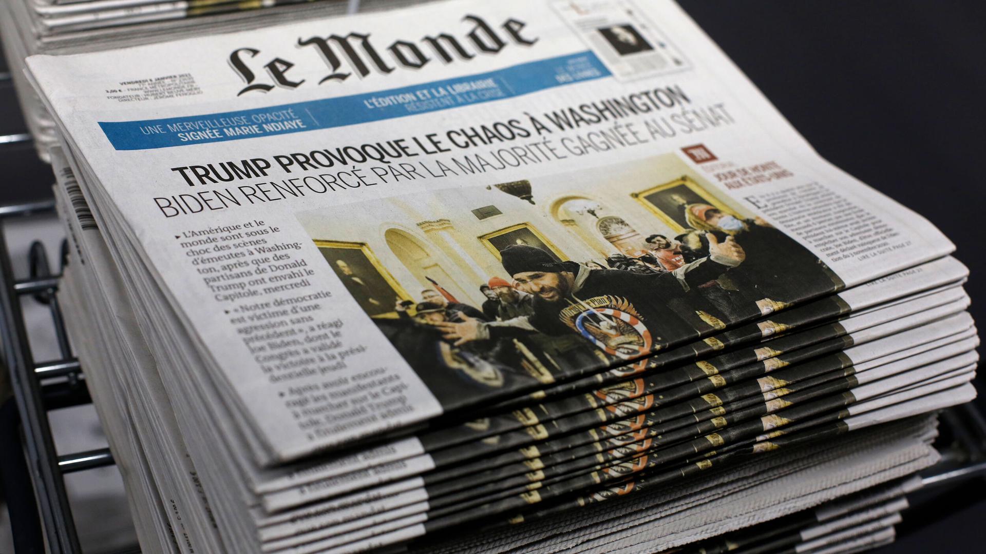 Copies of the French newspaper Le Monde headlining on the Capitol attack, Jan.7, 2021 in Paris.