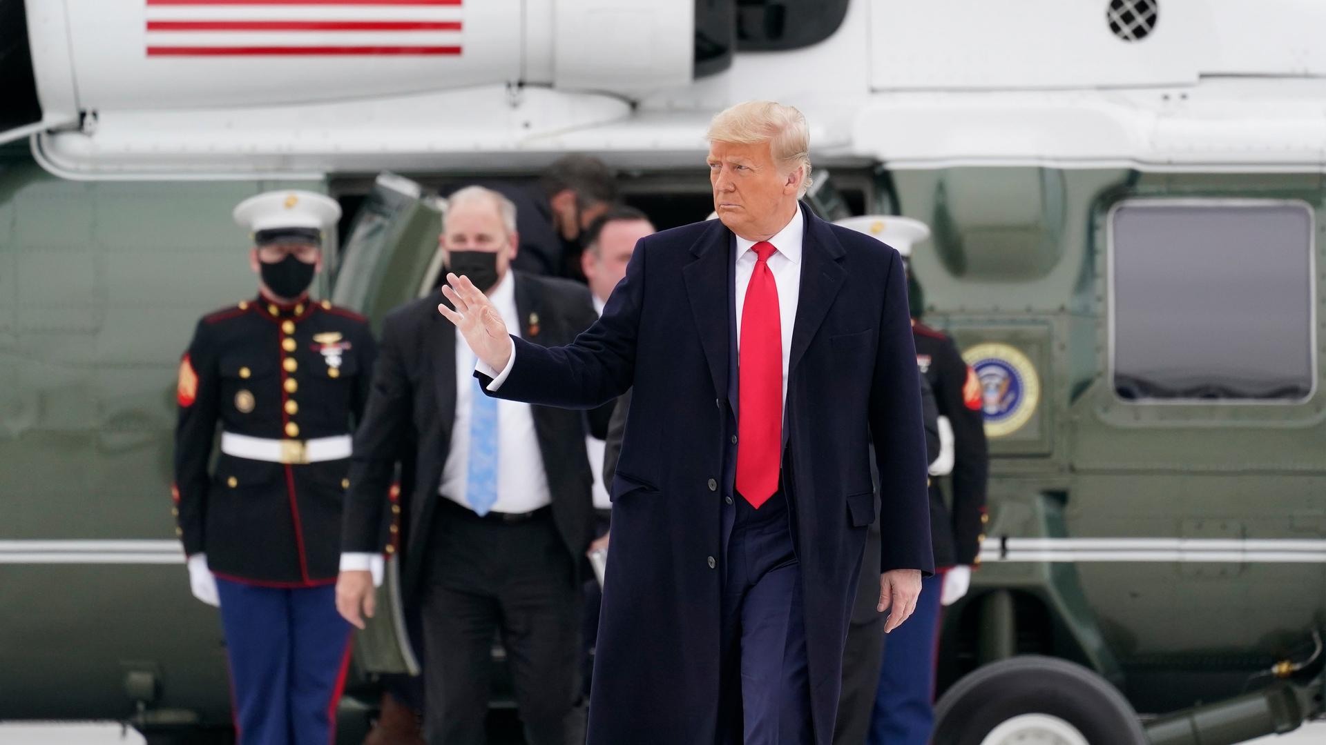 President Donald Trump boards Air Force One upon arrival at Valley International Airport on Tuesday, Jan. 12, 2021, after visiting a section of the border wall with Mexico in Alamo, Texas. 