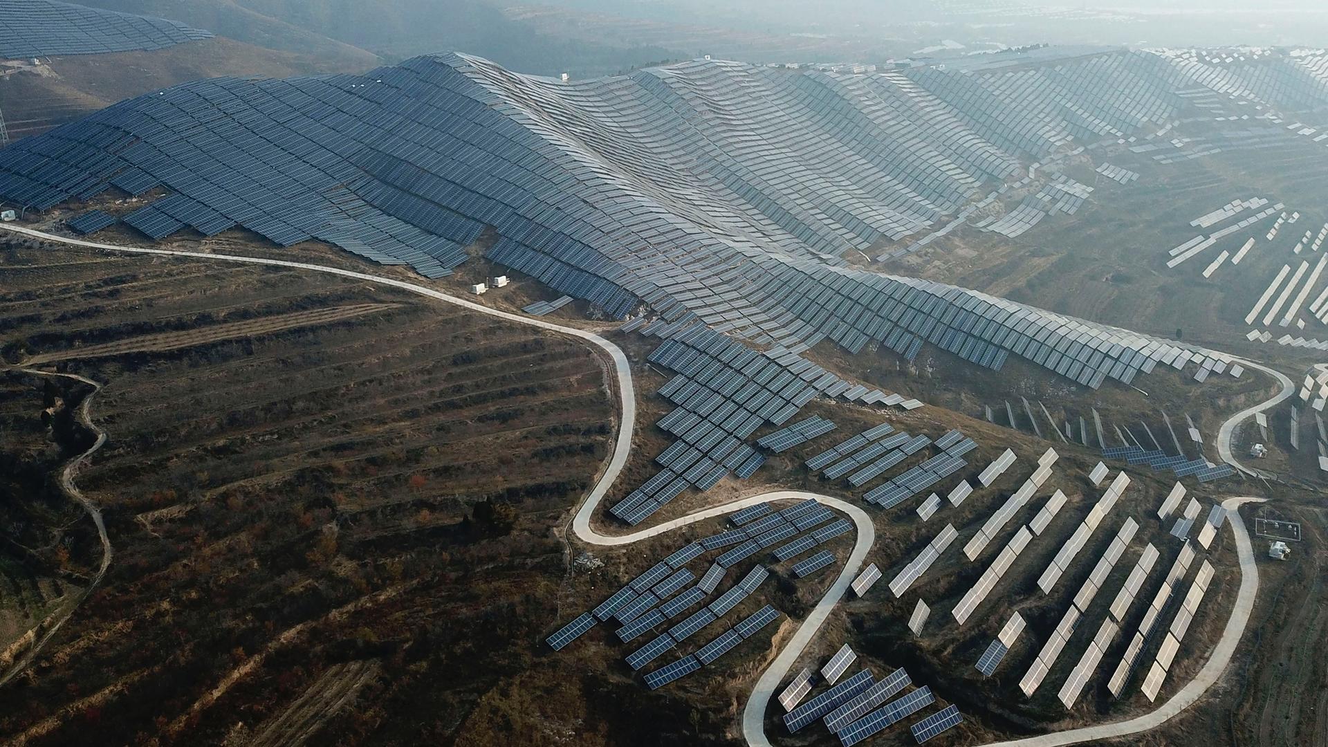 In this Nov. 28, 2019, photo, a solar panel installation is seen in Ruicheng County in central China's Shanxi Province. 