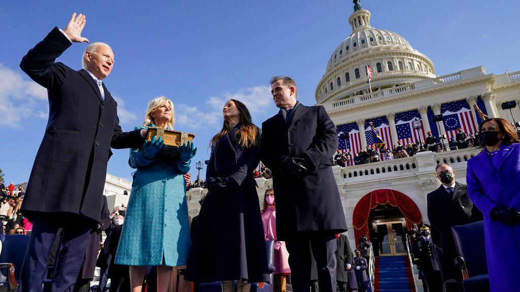 Joe Biden is sworn in as the 46th president of the United States by Chief Justice John Roberts as Jill Biden holds the Bible during the 59th Presidential Inauguration at the US Capitol in Washington, Jan. 20, 2021.