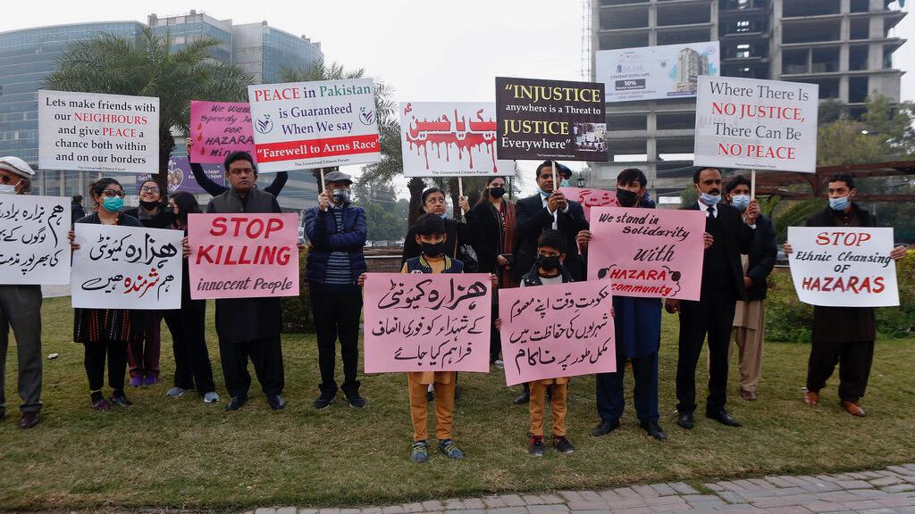 Supporters of a civil society organization hold a demonstration to protest against the killing of coal mine workers by gunmen near the Machh coal field, in Lahore, Pakistan, Jan. 8, 2021. Pakistan's prime minister Friday appealed to the protesting minorit