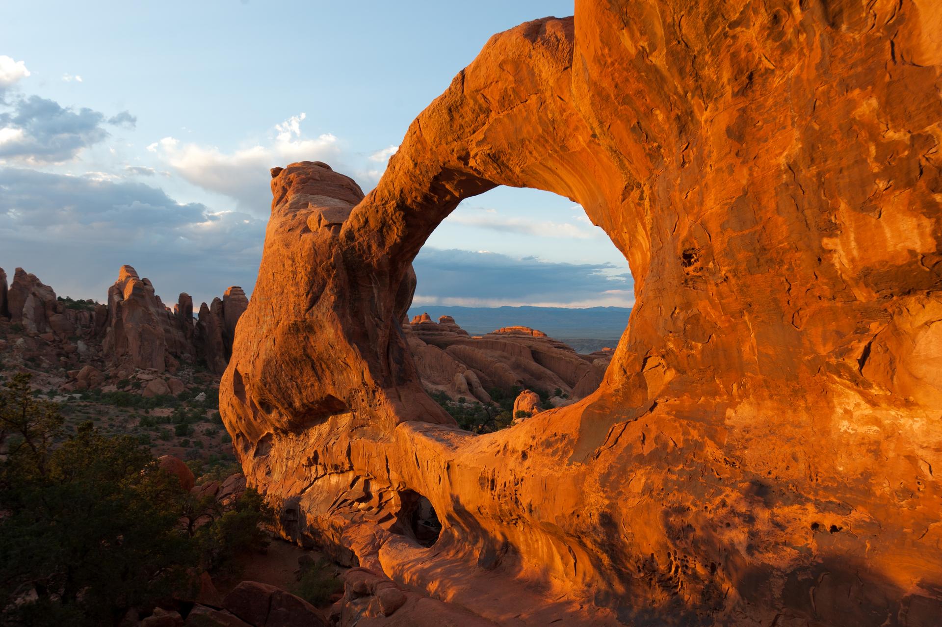 Brown arches naturally formed from stone in Arches National Park 