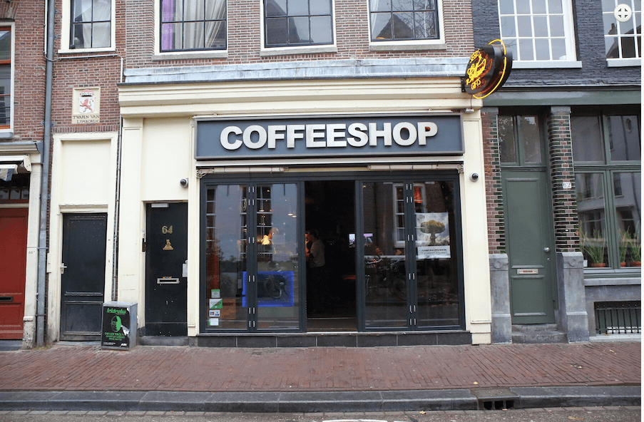 The outside facade of a Green House coffee shop in Amsterdam, Netherlands.