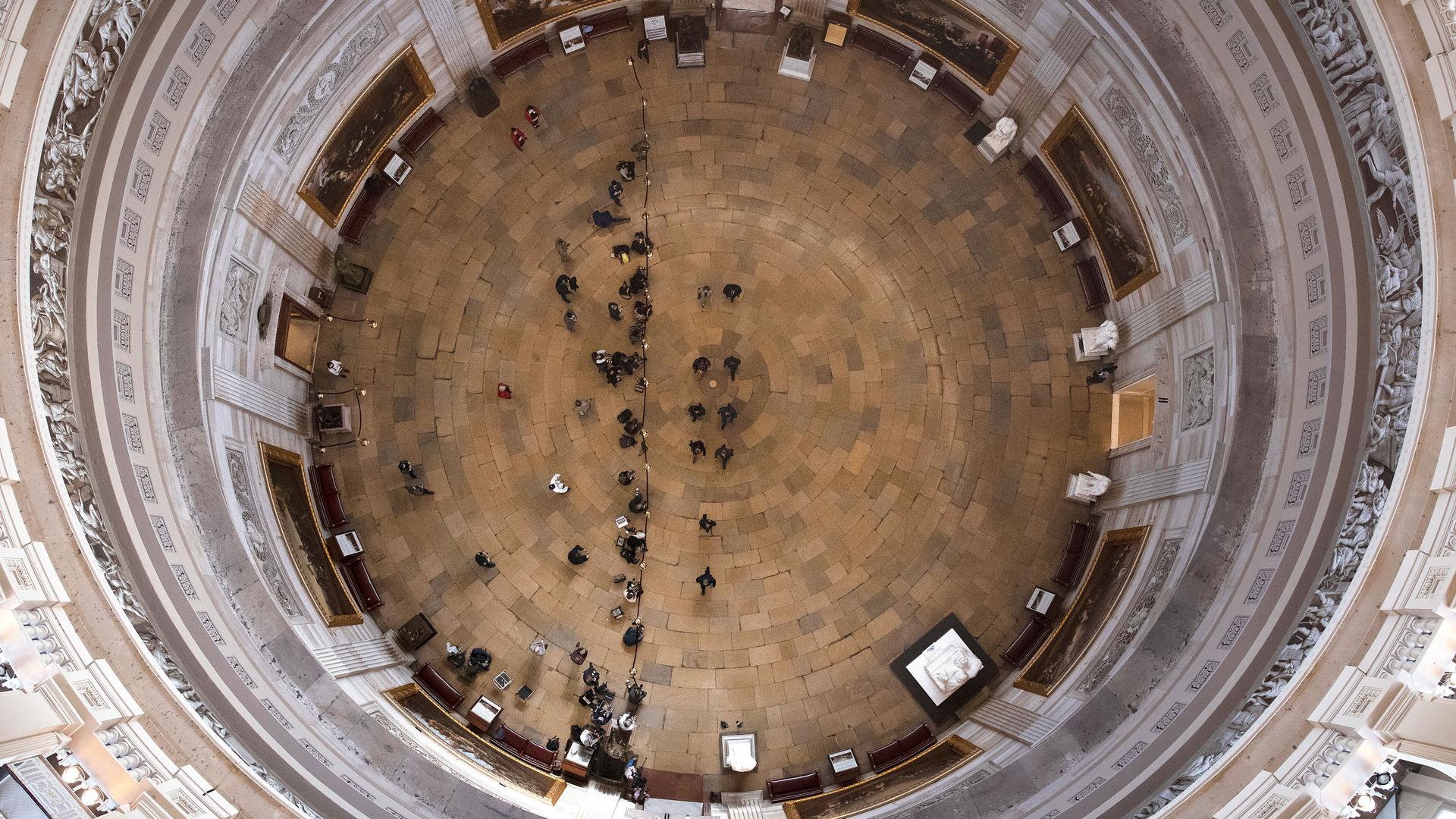 The Rotunda to the Senate is shown looking down from above with the complete circle of the space framing the composition.