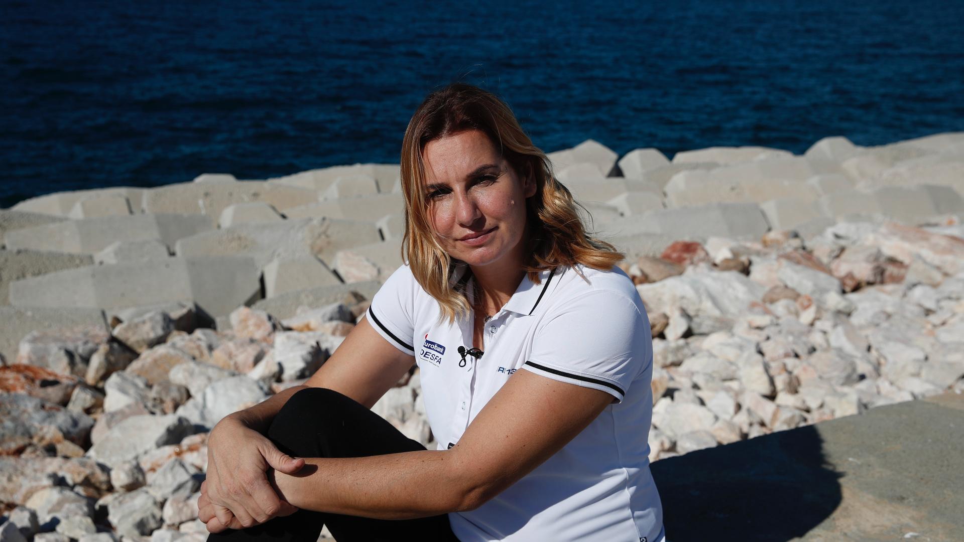 Greek Olympic sailing champion Sofia Bekatorou poses for a photograph during an interview for The Associated Press, at Agios Kosmas marina in southern Athens, Feb. 4, 2021. Bekatorou is the most successful female athlete in Greek sporting history who rece