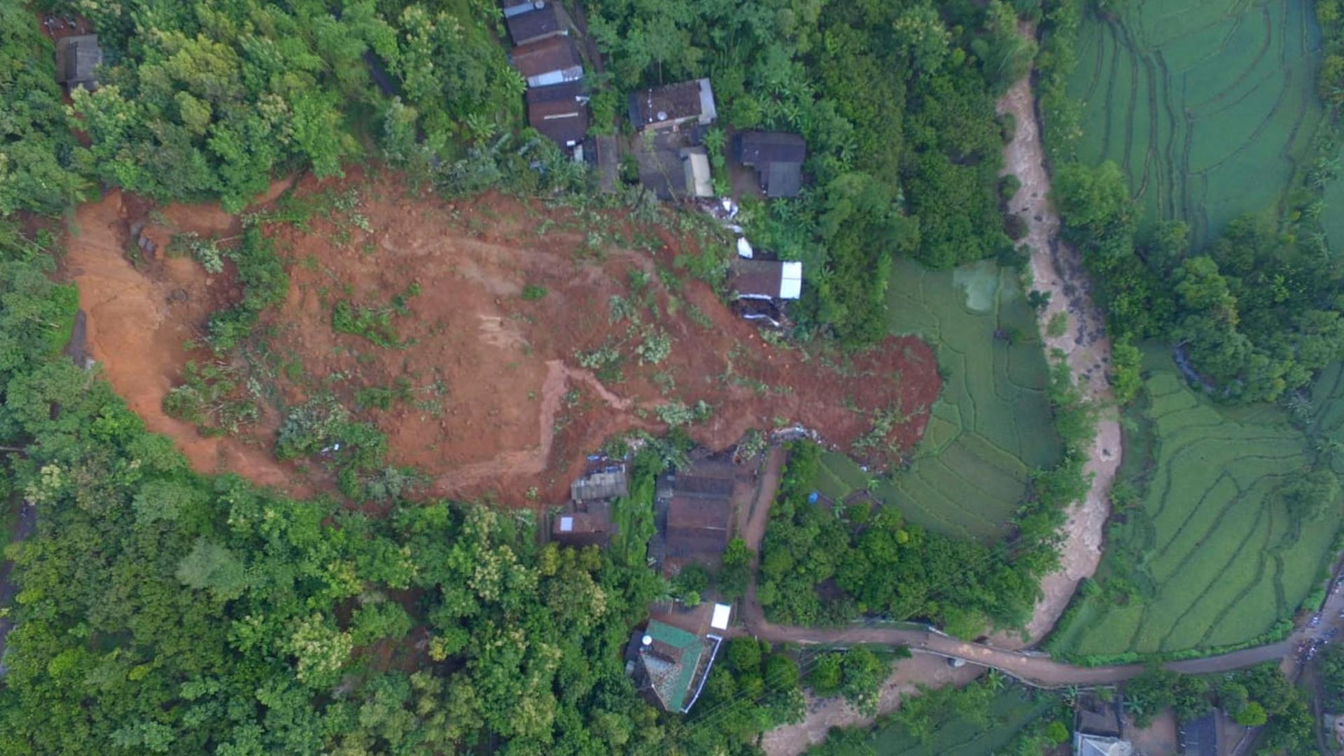 This aerial shot released by the Regional Disaster Mitigation Agency (BPBD) shows a village affected by a landslide in Nganjuk, East Java, Indonesia, Monday, Feb. 15, 2021. 