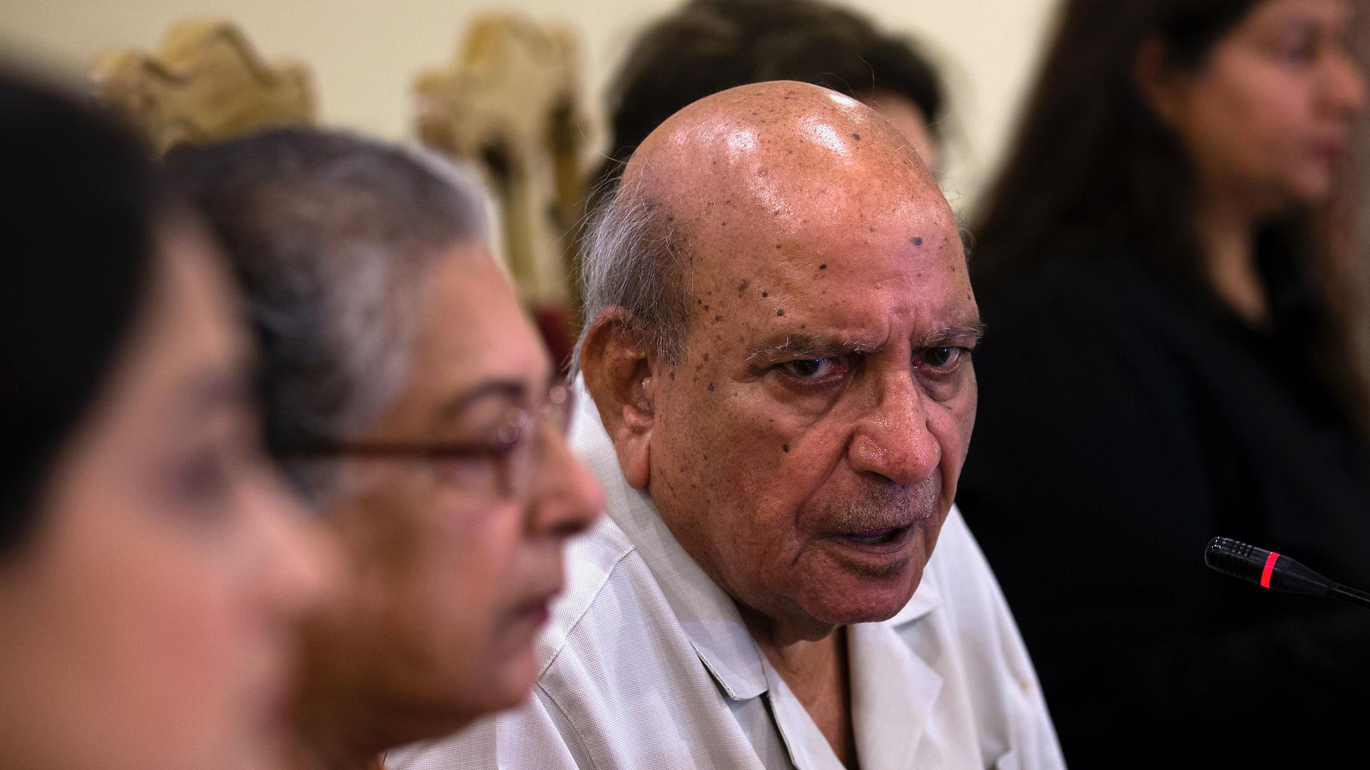 IA Rehman, center, an official from the Human Rights Commission addresses a news conference, in Islamabad, Pakistan, July 16, 2018. Rehman, an iconic Pakistani human rights defender and former editor, has died in the eastern city of Lahore after a brief i