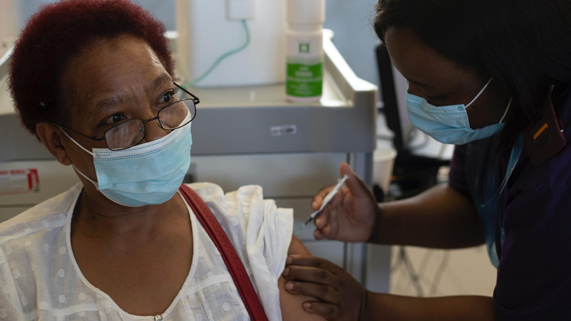Health care worker Maggie Sedidi receives a Johnson & Johnson COVID-19 vaccine at a vaccination center in Soweto, South Africa, March 5, 2021. 