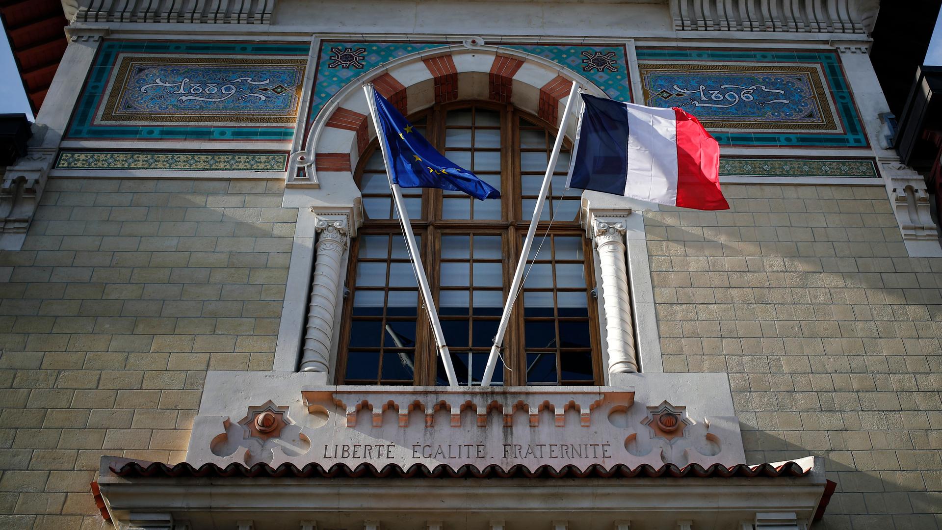 French and European Union flags fly at entrance to France's top elite school. 