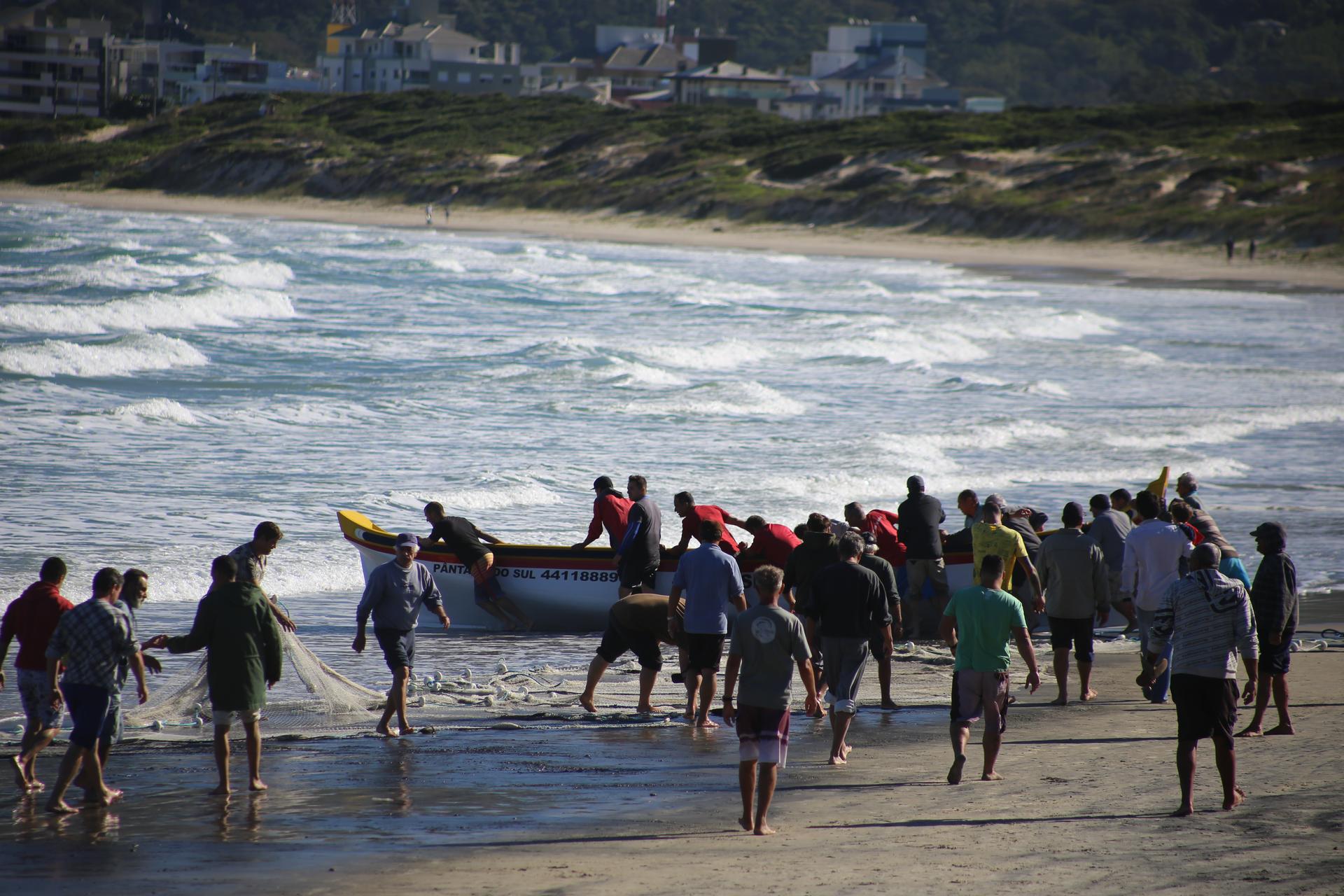 Fisherfolk meet at the sea to catch tainha in Pantano do Sul, Brazil.