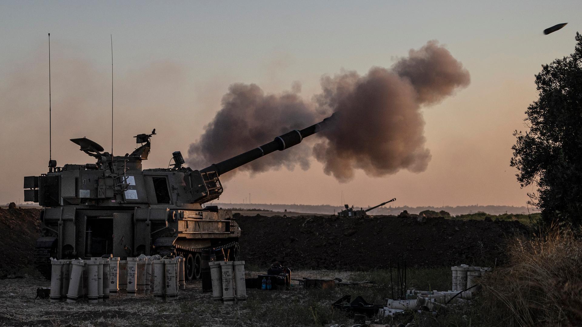 An Israeli artillery unit fires toward targets in Gaza Strip, at the Israel-Gaza border, Tuesday, May 18, 2021. 