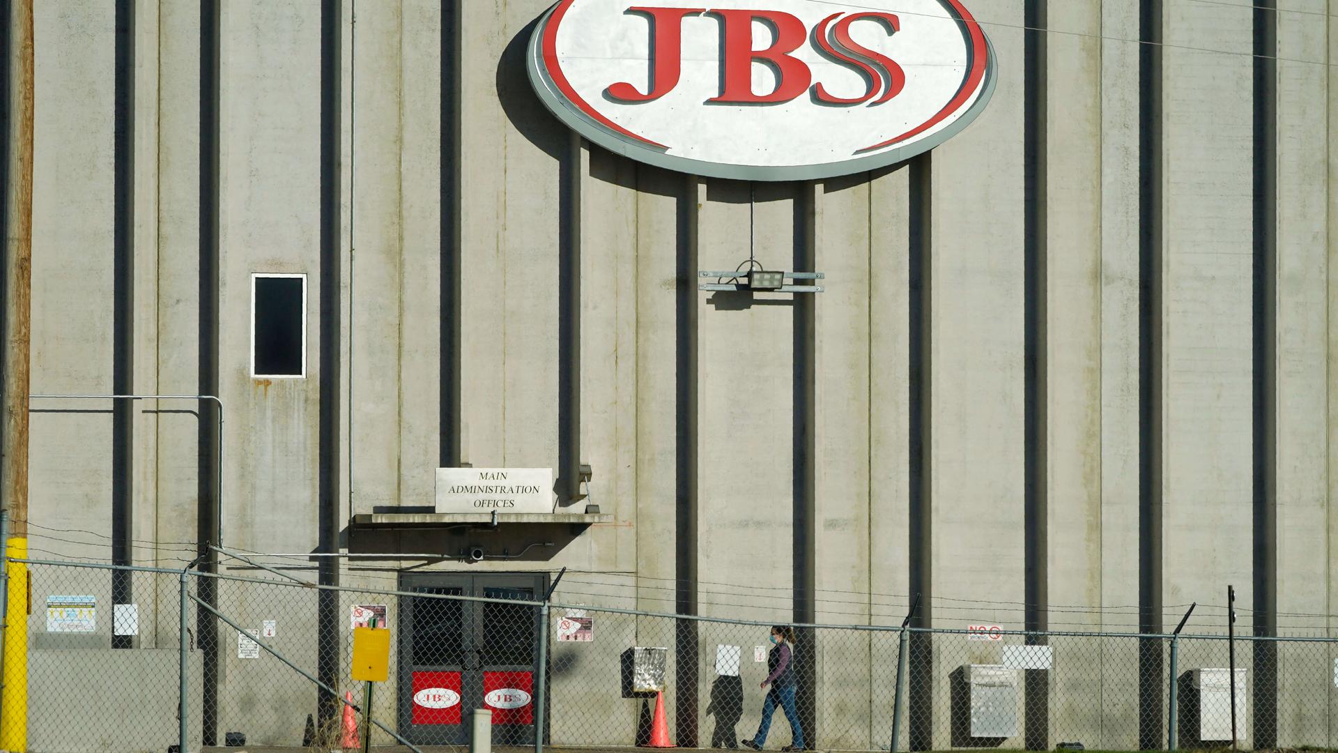 JBS red sign on meat factory building facade.