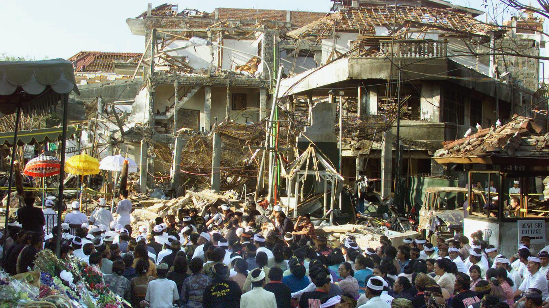 Local Balinese offer prayers for the victims at the site of the bomb blast in Kuta, Bali, Oct. 18, 2002. Nearly 200 people were killed and more than 300 were injured in the nightclub bombing. 