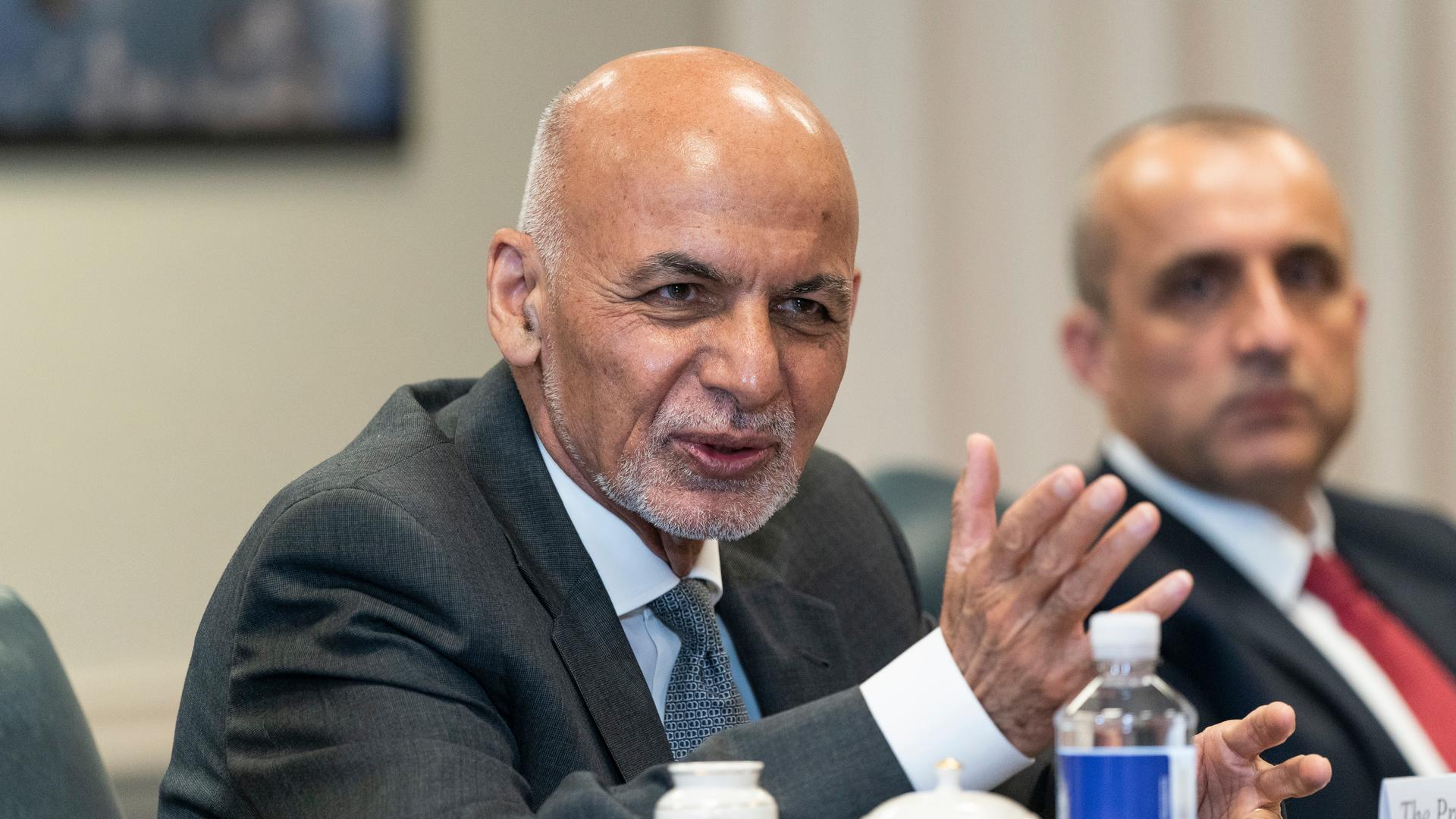Afghan President Ashraf Ghani, left, speaks before a meeting with Secretary of Defense Lloyd Austin at the Pentagon in Washington, Friday, June 25, 2021. 