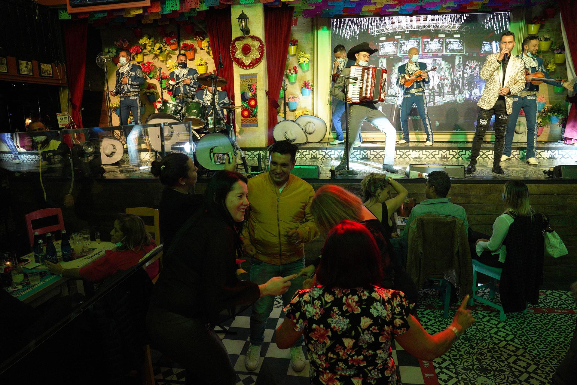 People mingle at the Plaza MX nightclub in Bogotá, Colombia