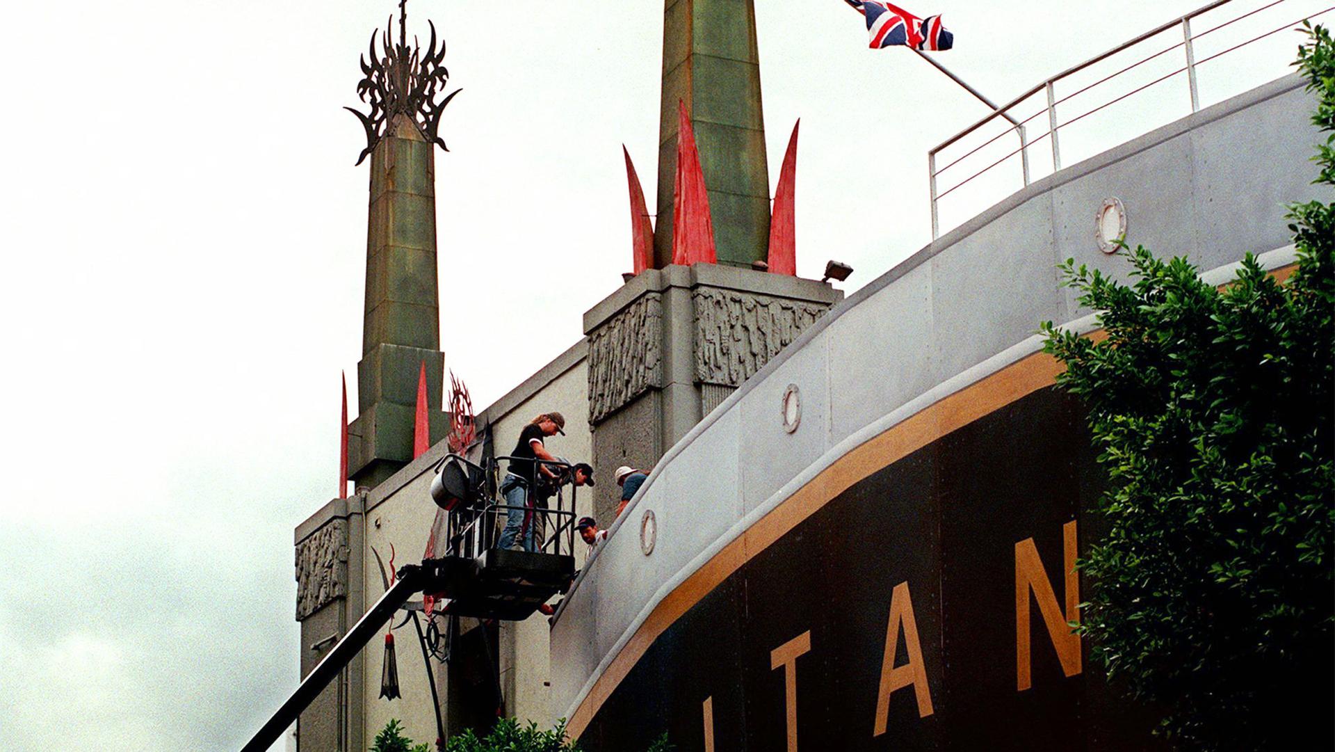 Men working on the facade of a Titanic replica in China