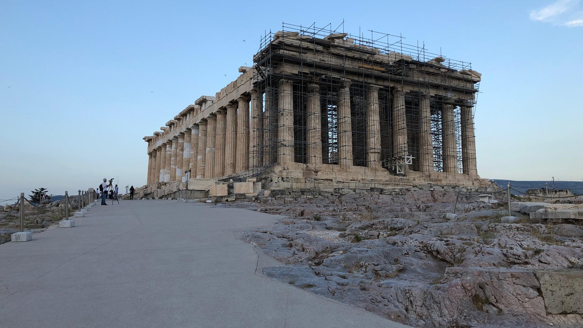 A concrete walkway has been paved on the Acropolis plateau in an effort to make the site more accessible. But critics say materials used would make it impossible to remove the pathway without damaging the ancient bedrock underneath.