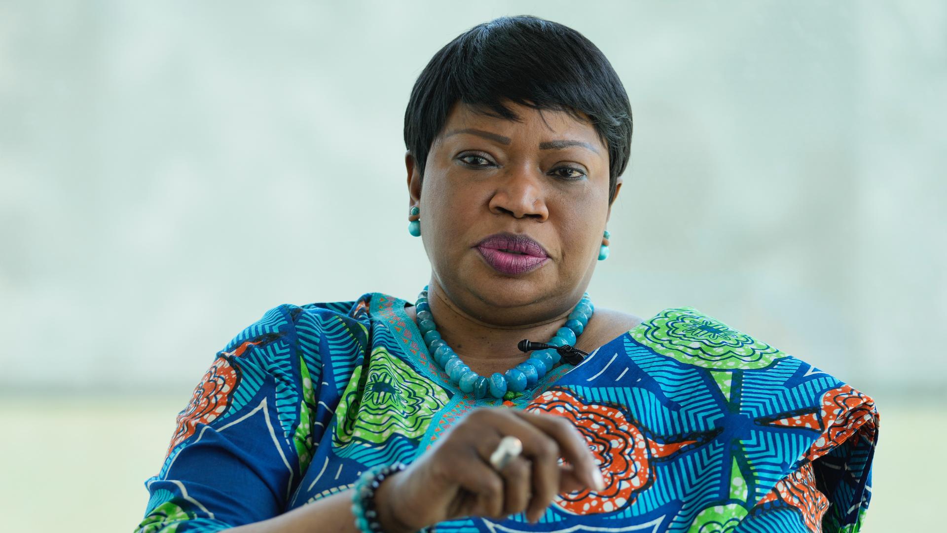 Photo of ICC Prosecutor Fatou Bensouda wearing a blue, green and orange outfit