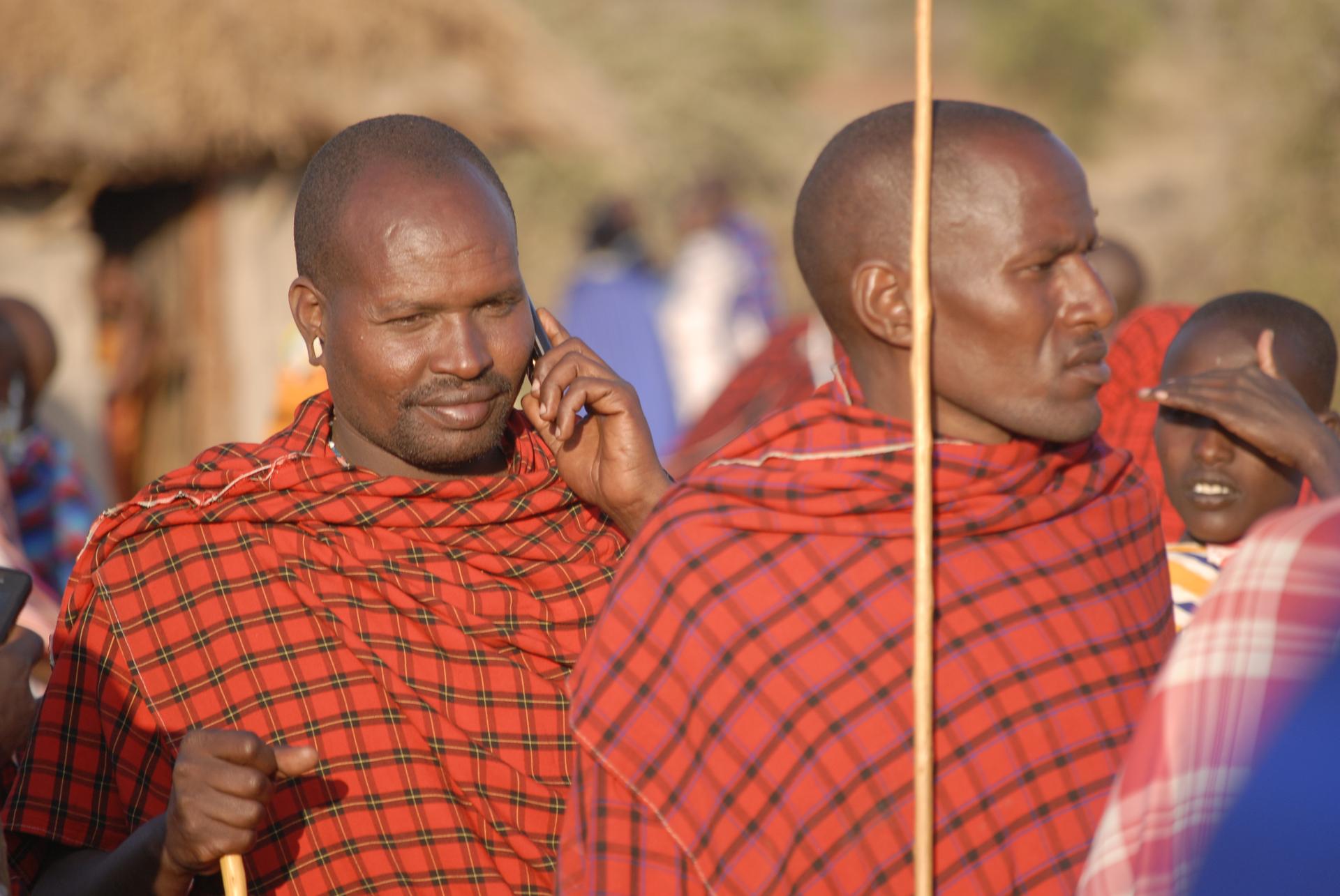 A Maasai man receives a call on his mobile phone. 