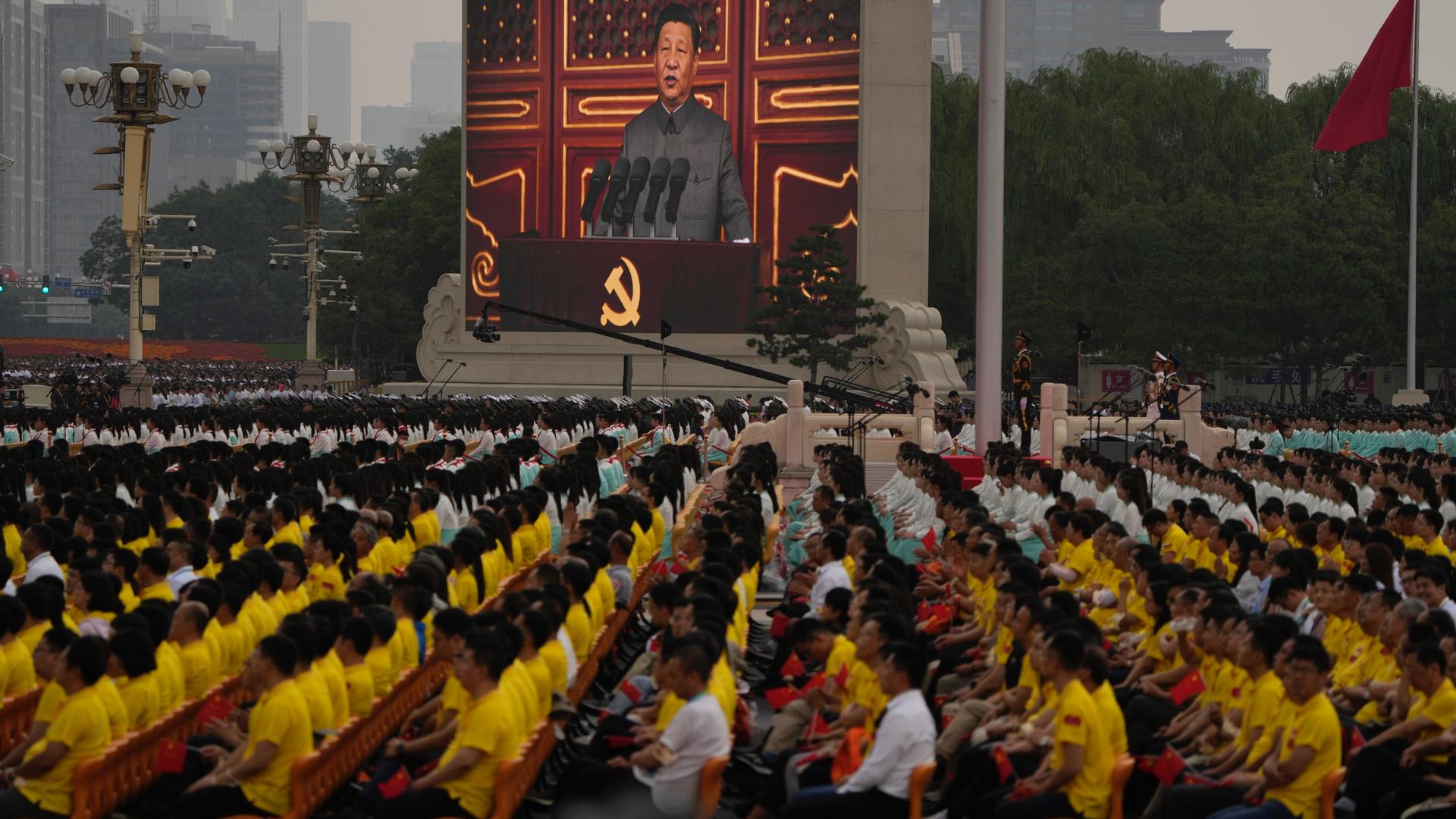 A screen shows Chinese President Xi Jinping speak during a ceremony to mark the 100th anniversary of the founding of the ruling Chinese Communist Party at Tiananmen Square in Beijing, July 1, 2021.