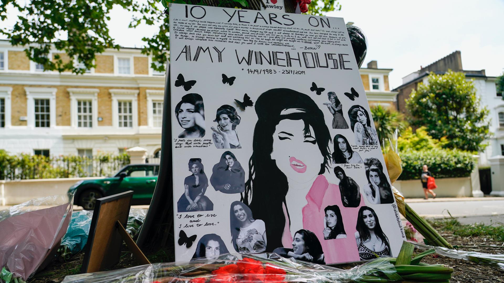 Tributes left outside the former home of Amy Winehouse in Camden, London, Friday, July 23, 2021, on the 10th anniversary of the iconic British singer's death from accidental alcohol poisoning.