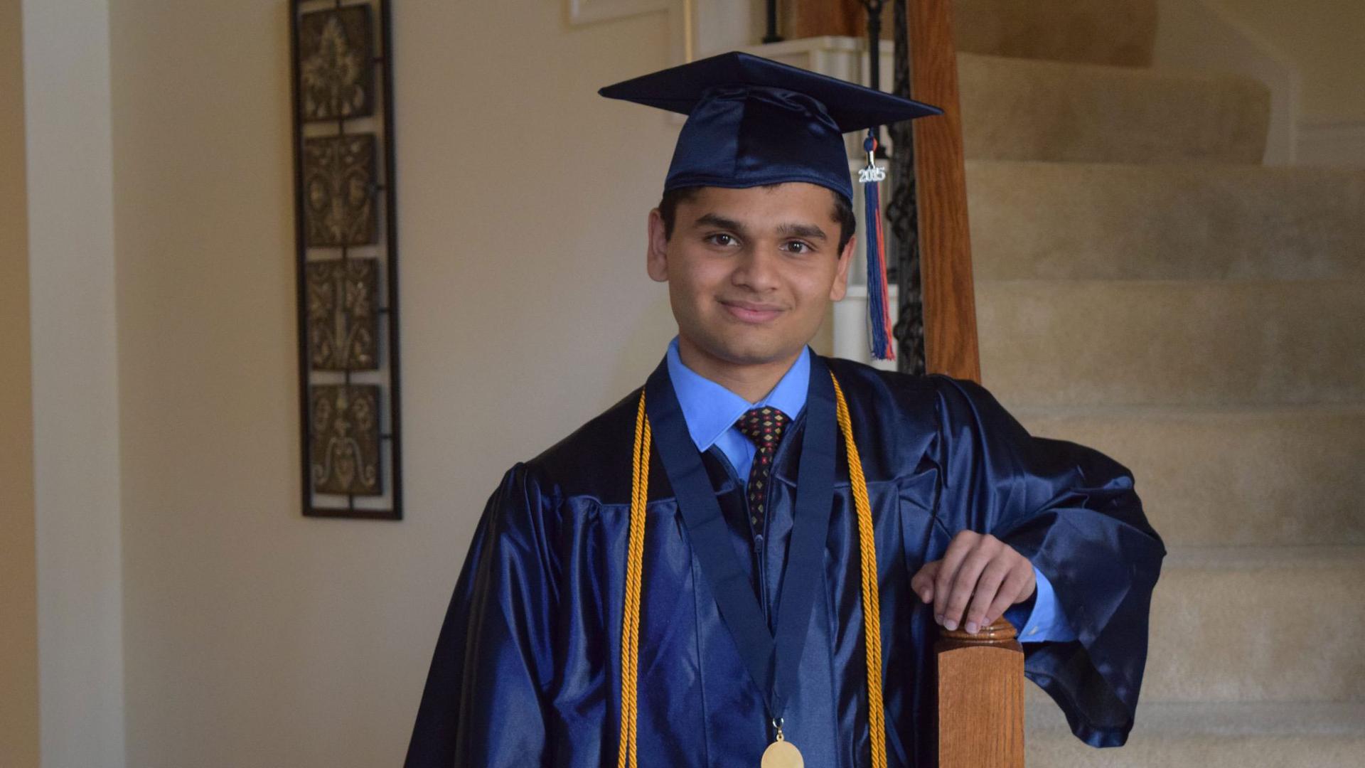 Animesh Namjoshi poses for a graduation photo after receiving his diploma at Seven Lakes High School