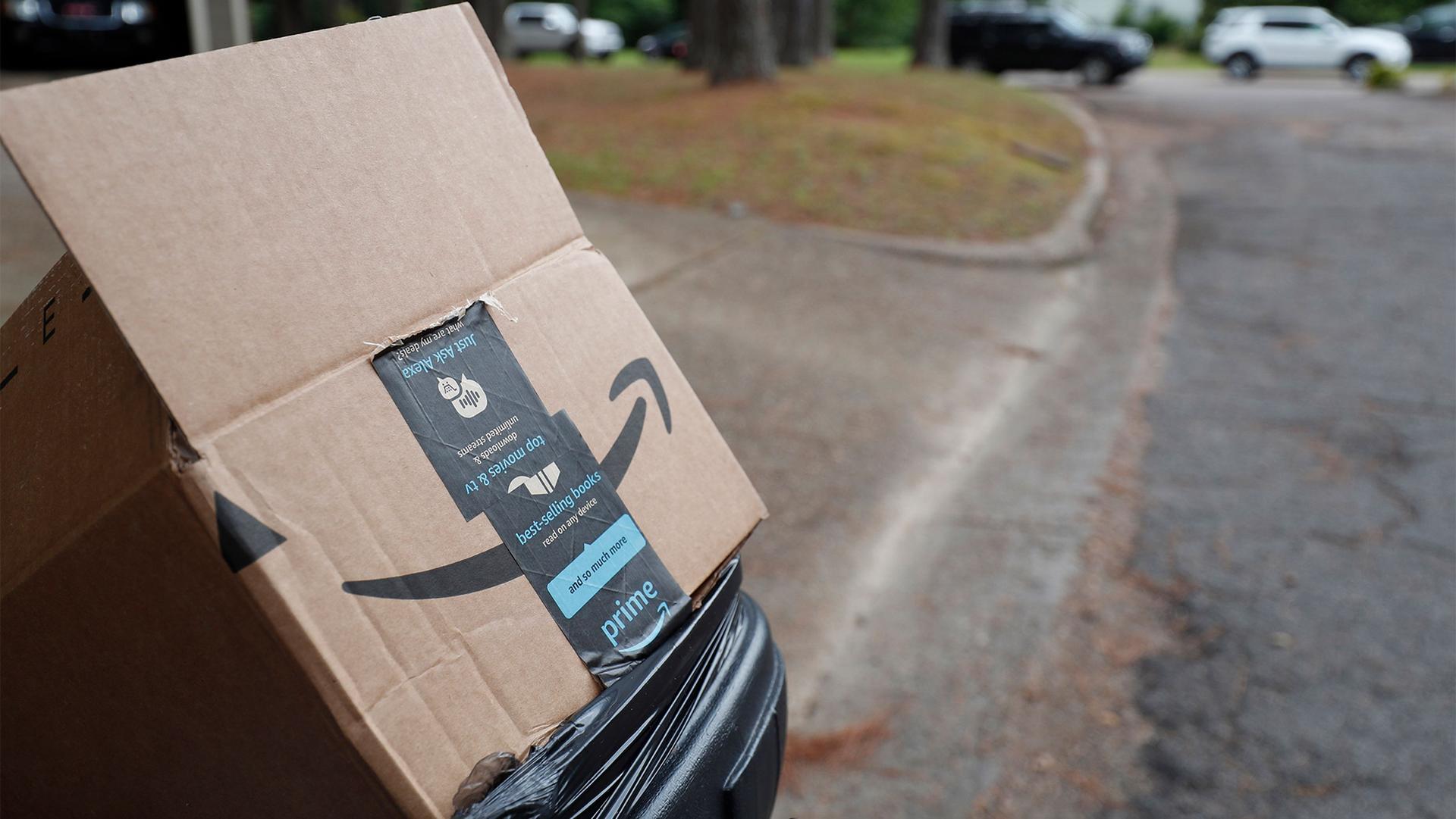 An empty Amazon box sits outside a north Jackson, Miss., residence, awaiting pickup for recycling